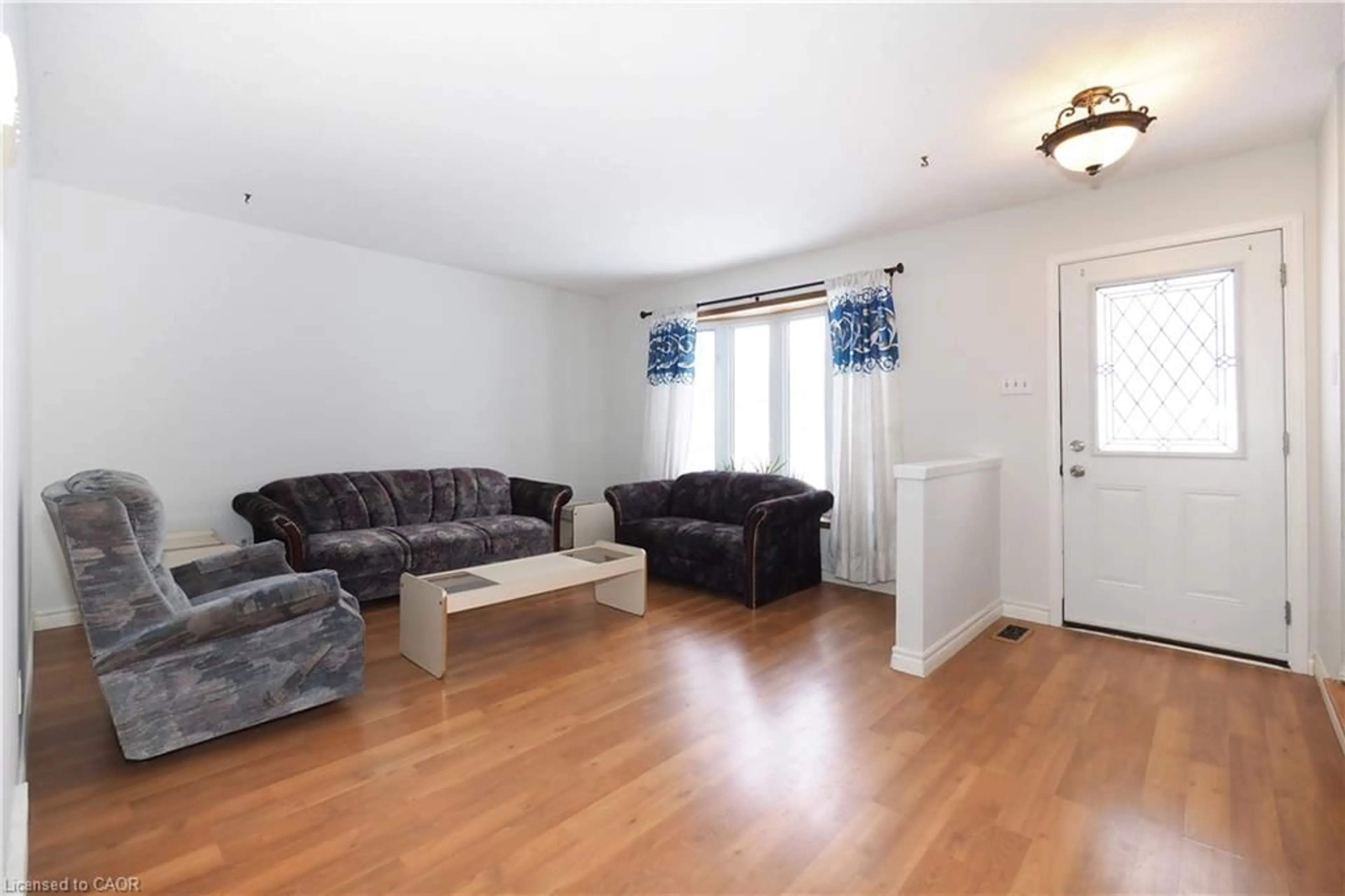 Living room with furniture, wood/laminate floor for 10 Balfour Cres, Kitchener Ontario N2C 1Z5