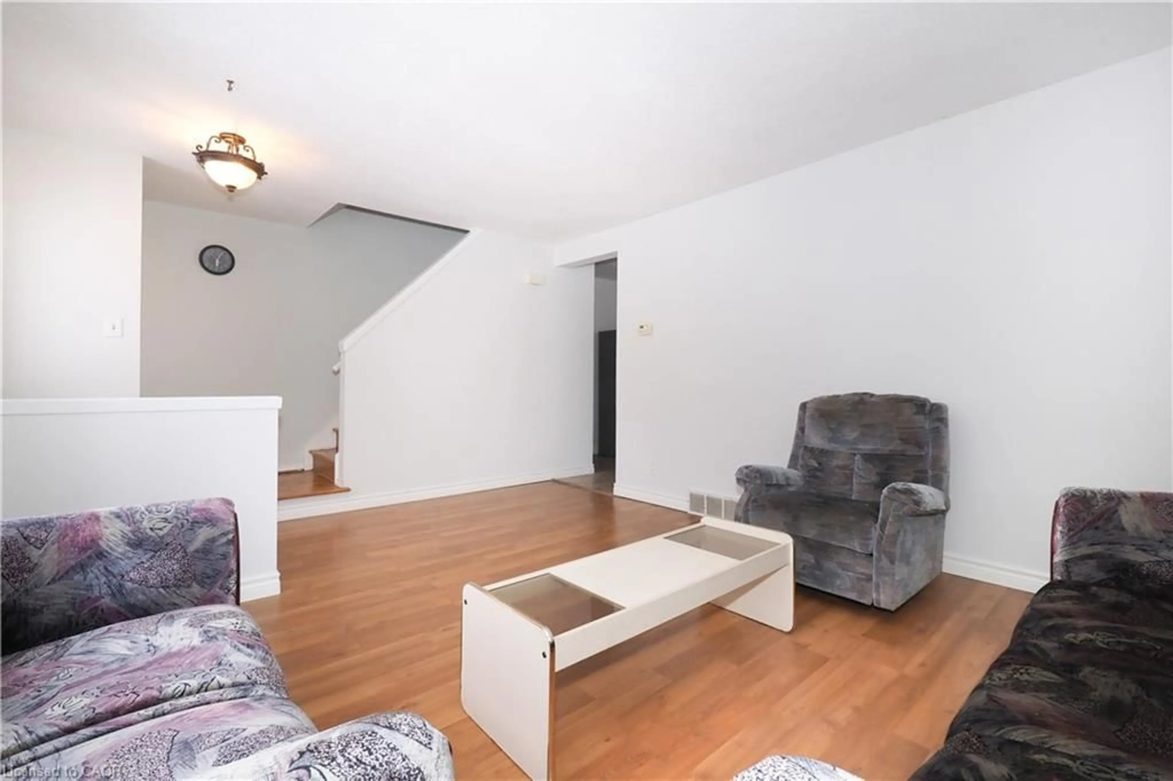 Living room with furniture, wood/laminate floor for 10 Balfour Cres, Kitchener Ontario N2C 1Z5