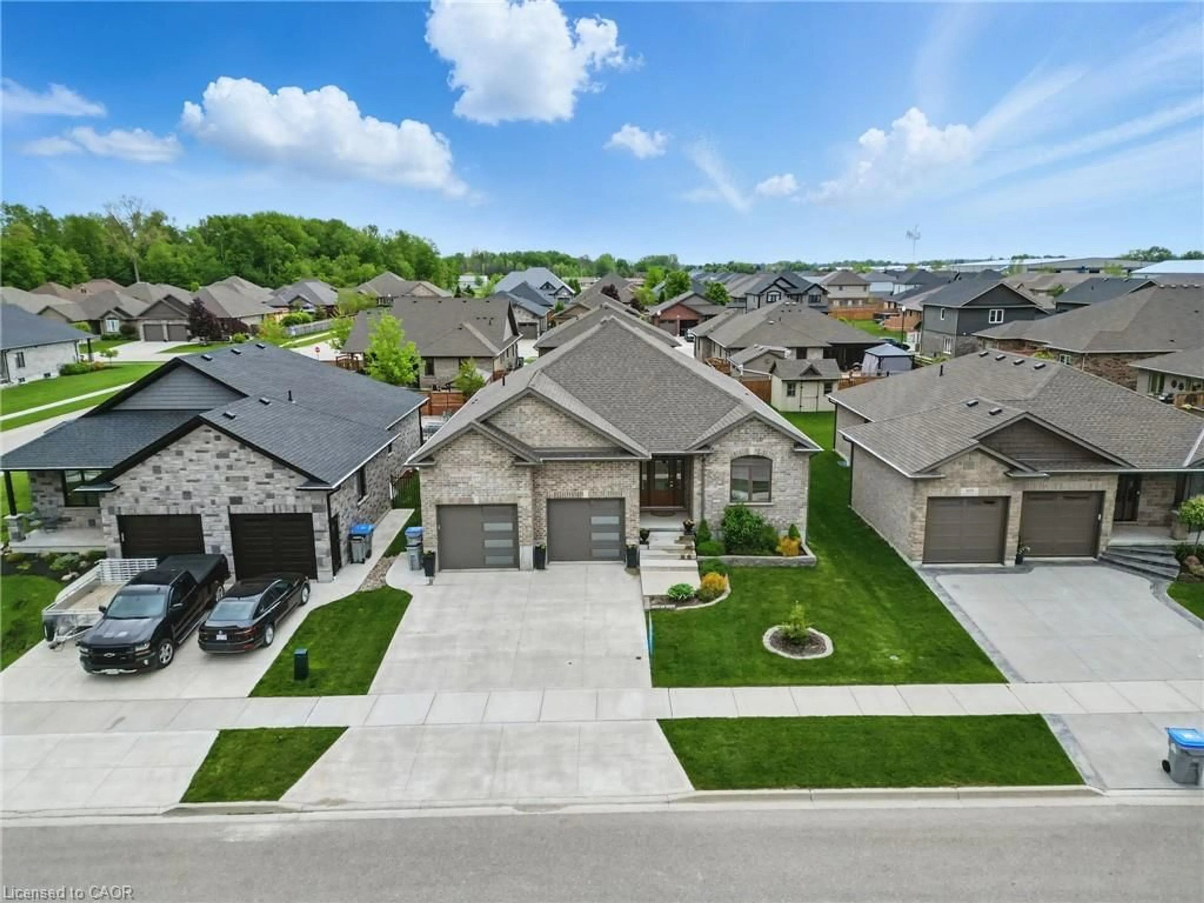 A pic from outside/outdoor area/front of a property/back of a property/a pic from drone, street for 107 Forbes Cres, Listowel Ontario N4W 0B4