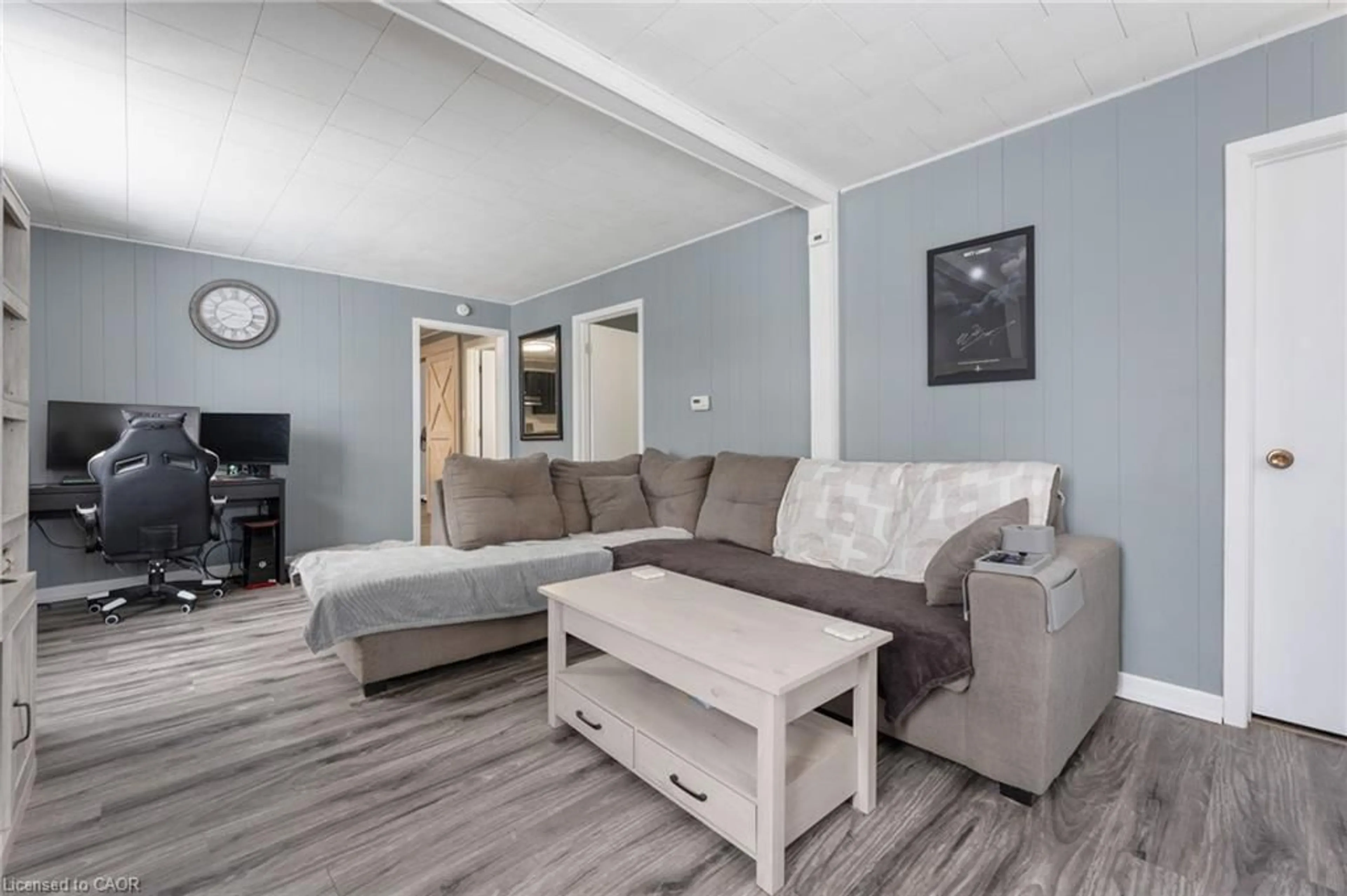 Living room with furniture, wood/laminate floor for 234 Head St, Simcoe Ontario N3Y 3X7