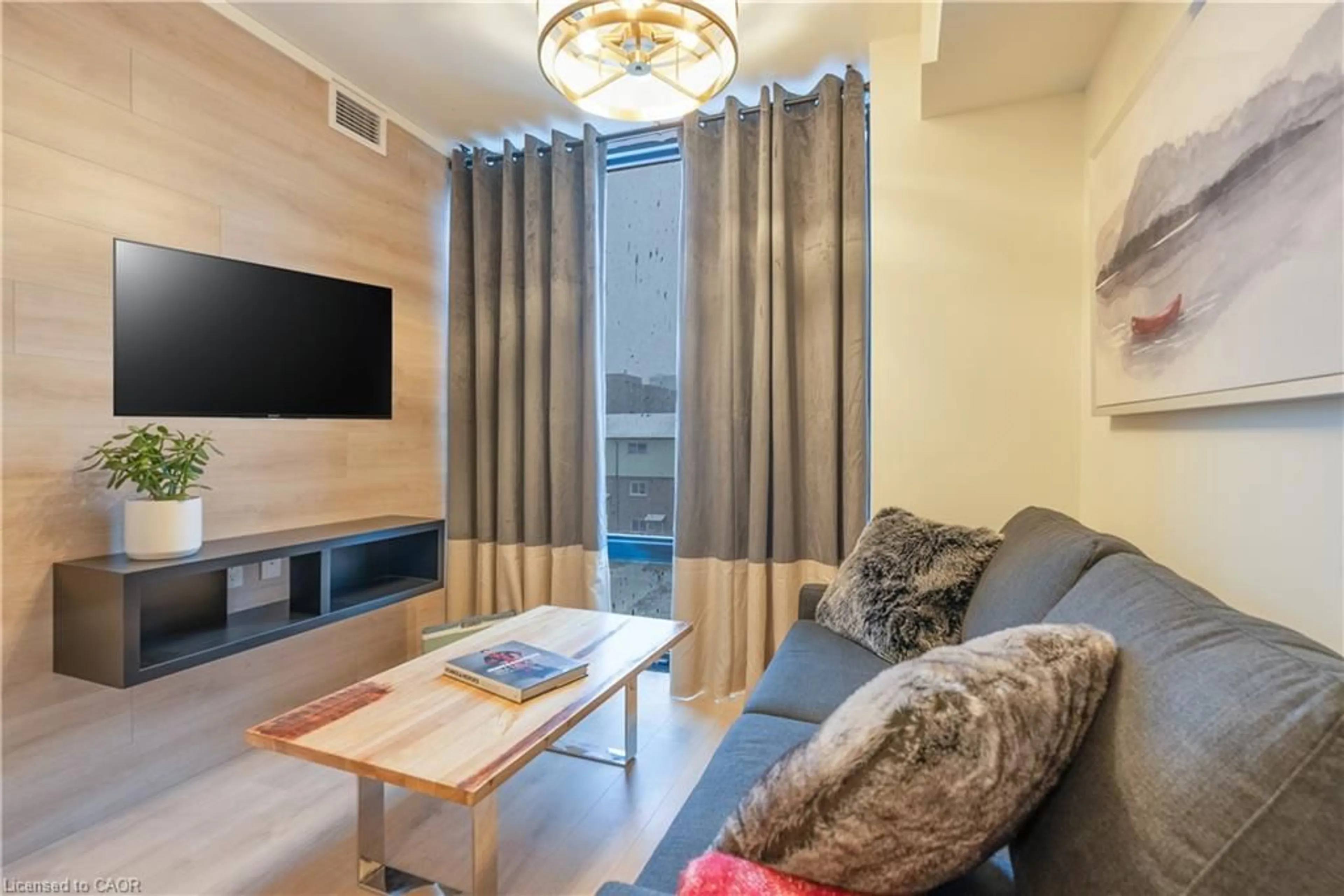 Living room with furniture, wood/laminate floor for 145 Columbia St #1408, Waterloo Ontario N2L 0K7