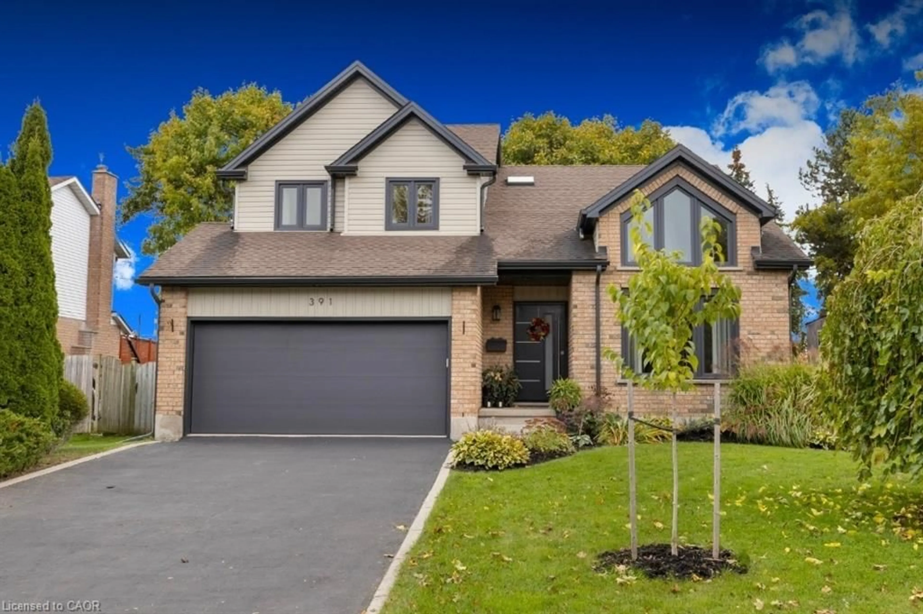 Home with brick exterior material, street for 391 Strawberry Cres, Waterloo Ontario N2K 3J4