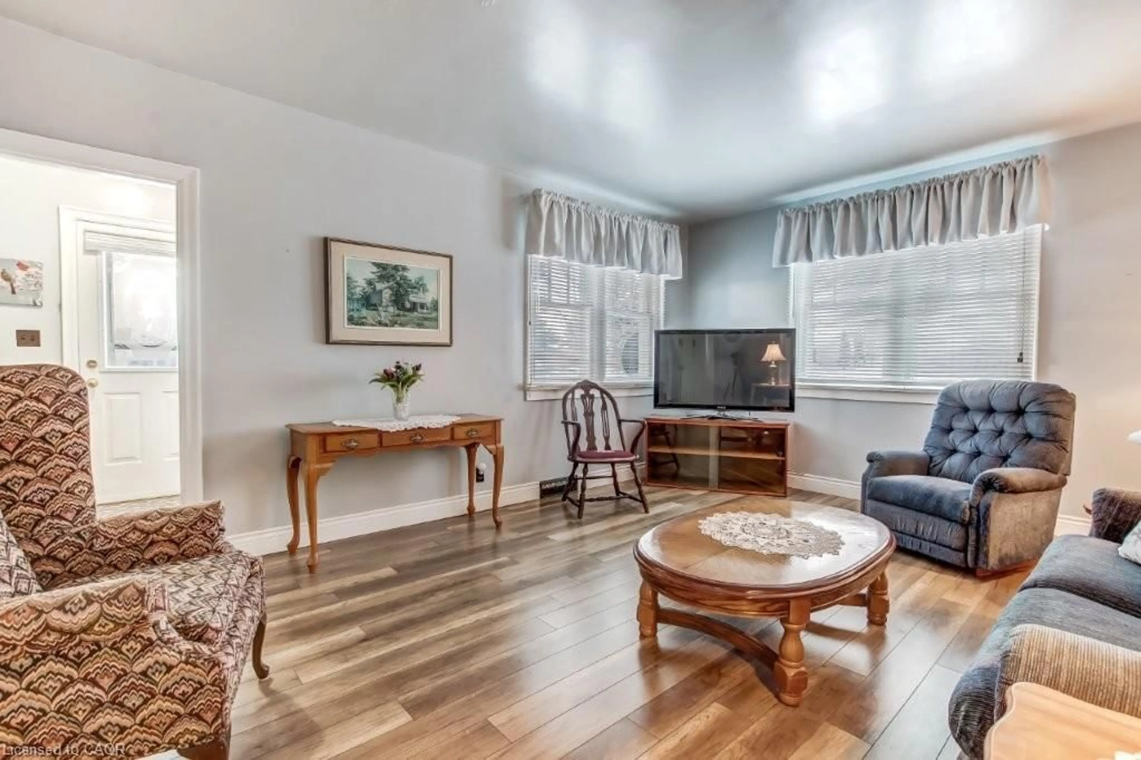 Living room with furniture, wood/laminate floor for 39 Queen St, St. Williams Ontario N0E 1P0