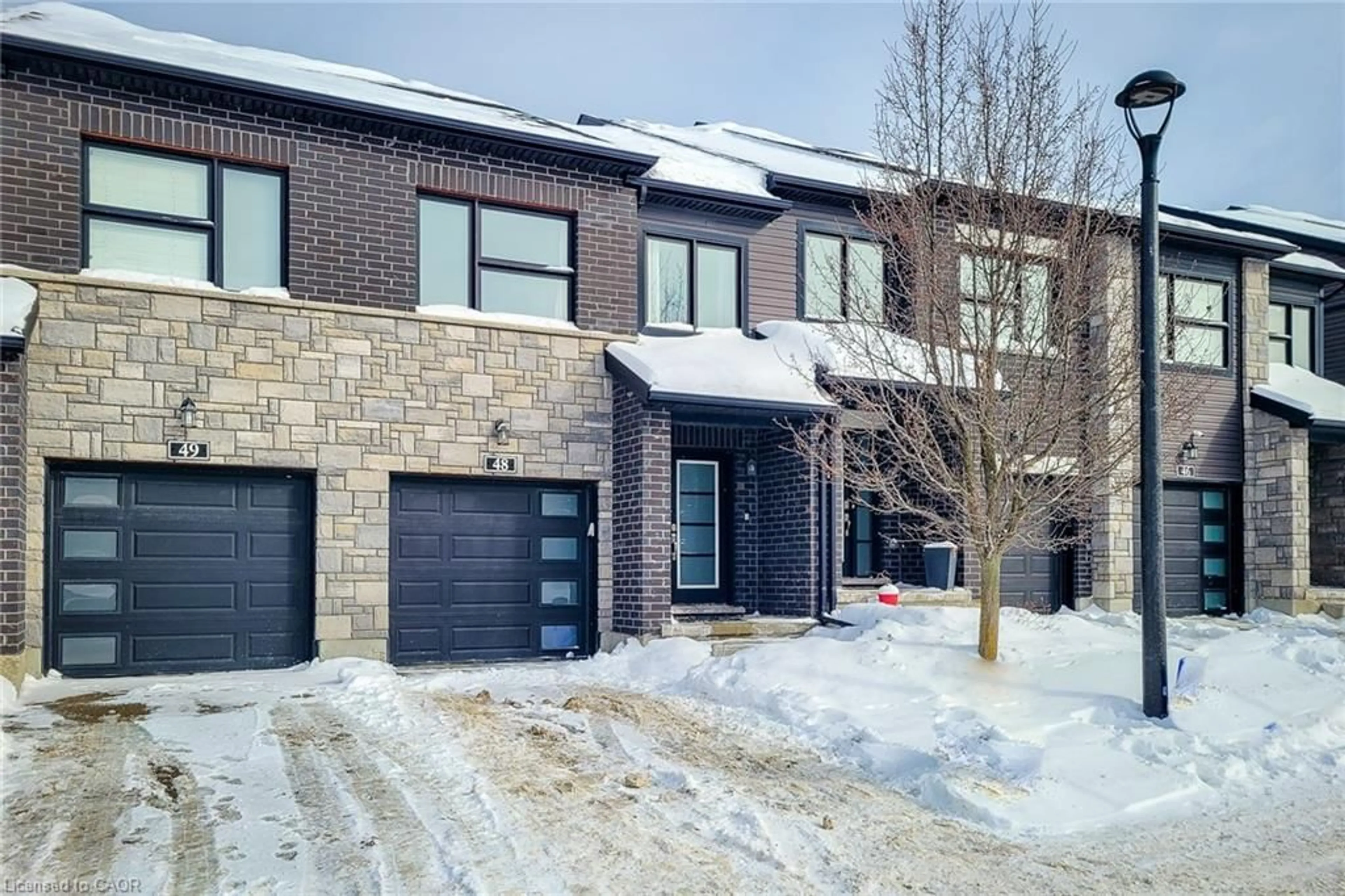 Home with brick exterior material, street for 91 Poppy Dr #48, Guelph Ontario N1L 0M6