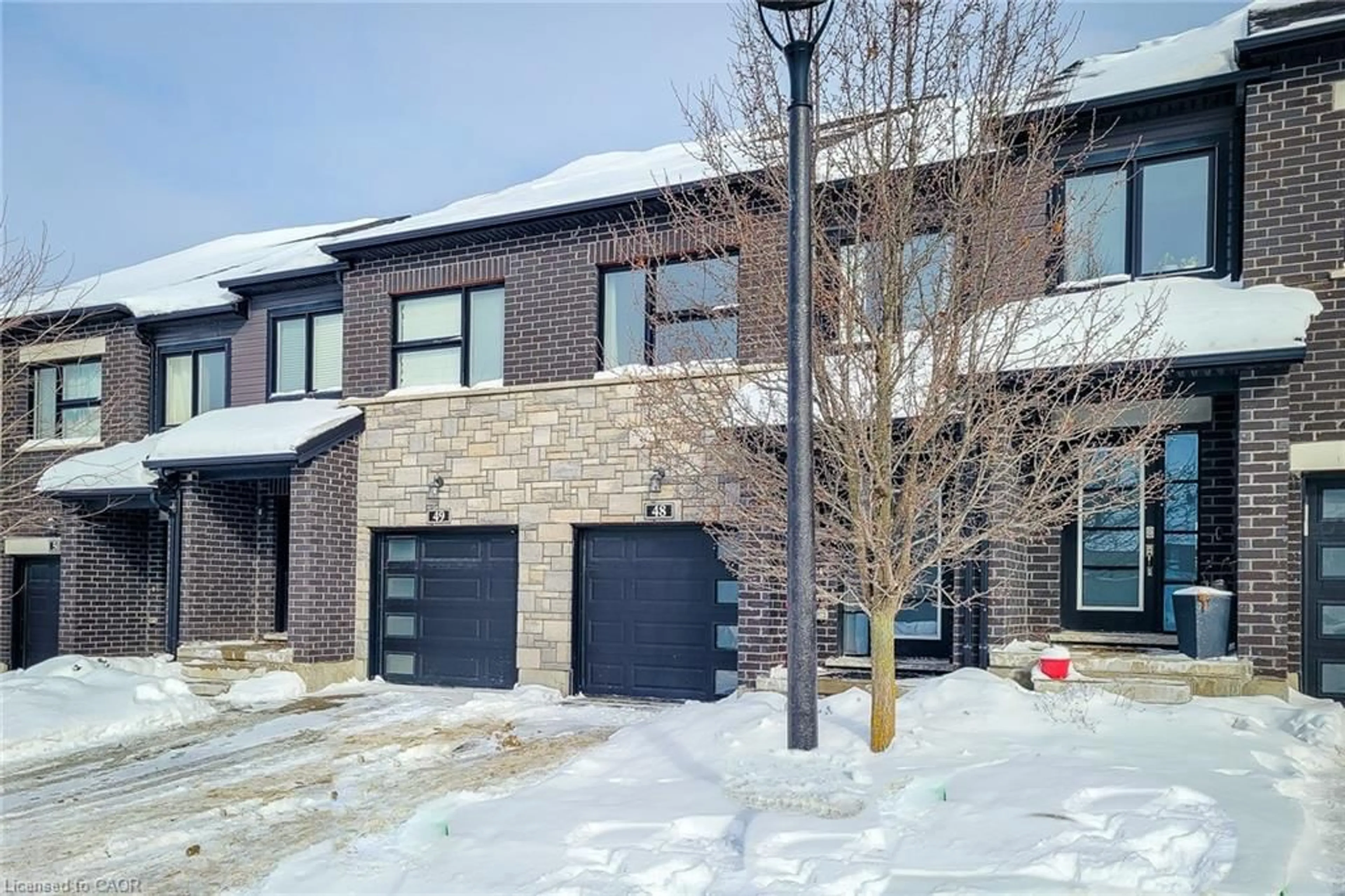 Home with brick exterior material, street for 91 Poppy Dr #48, Guelph Ontario N1L 0M6