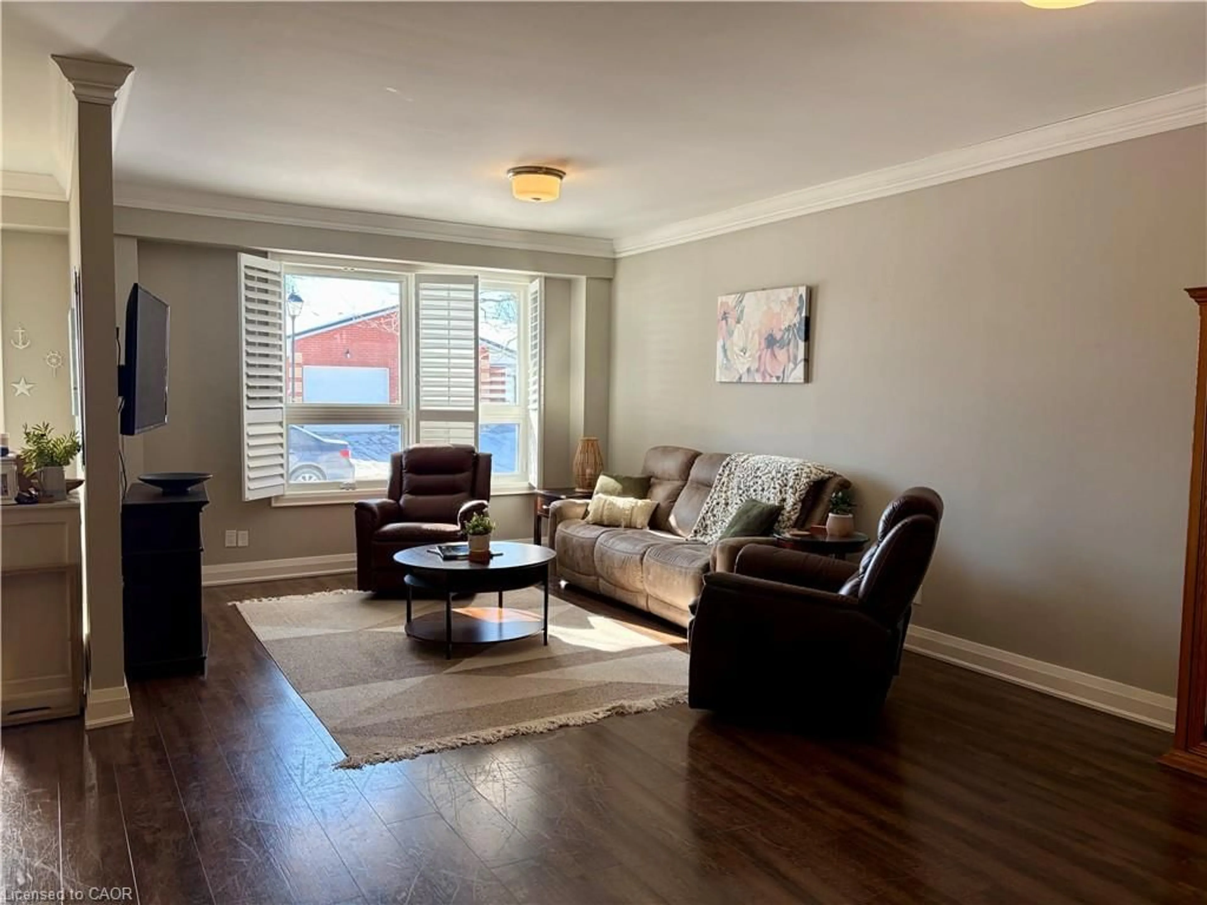 Living room with furniture, wood/laminate floor for 36 Bishop Sherlock Lane, Hamilton Ontario L9B 2S5