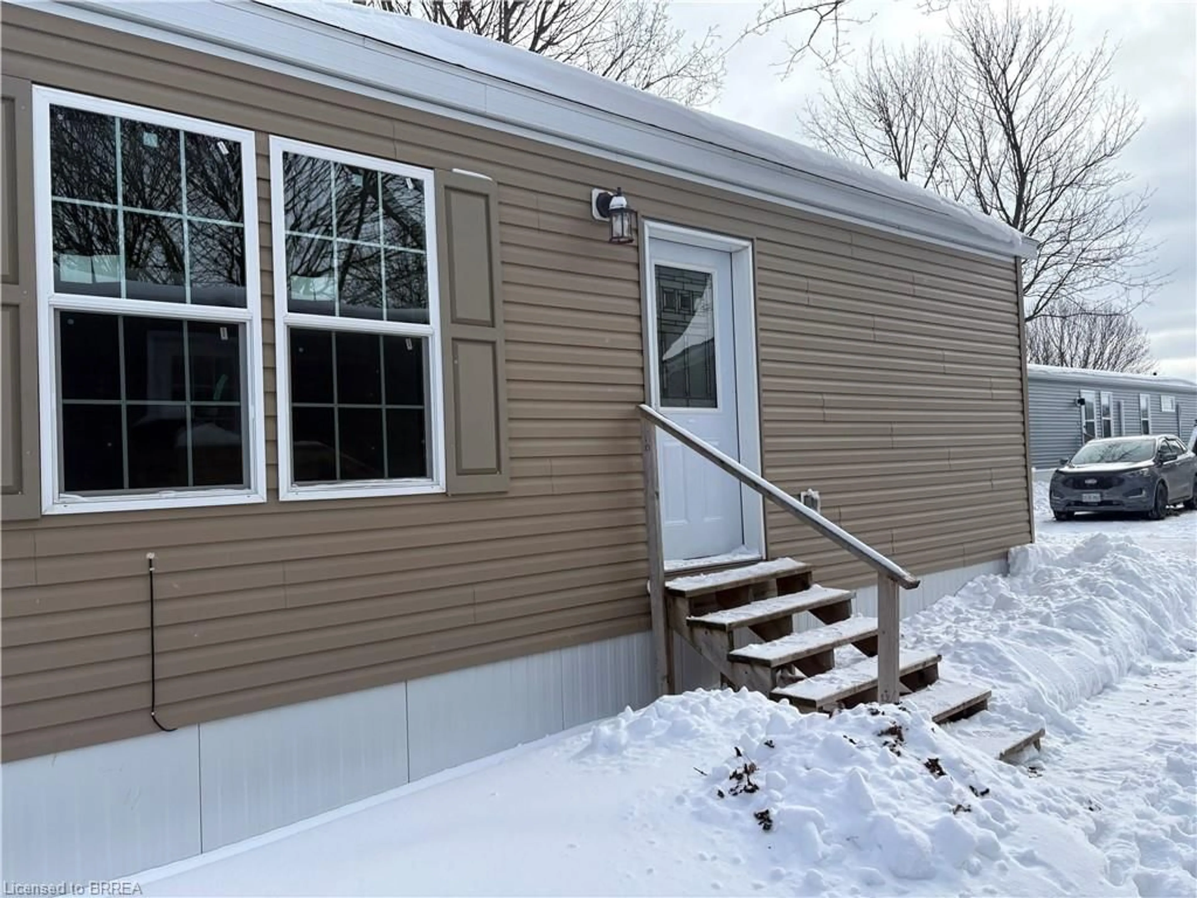 Home with vinyl exterior material, street for 99 Fourth Concession Rd #524, Burford Ontario N0E 1A0