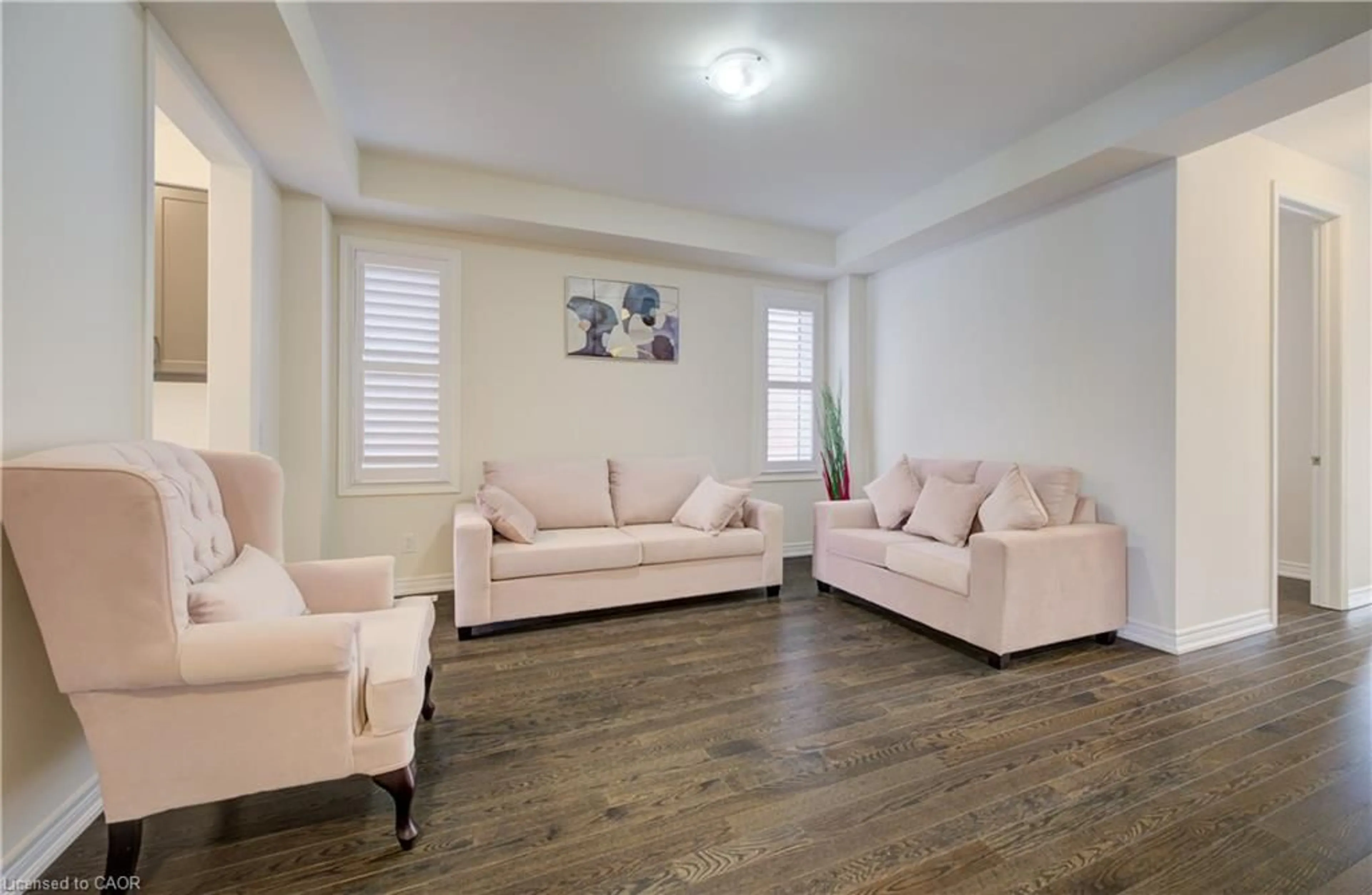 Living room with furniture, wood/laminate floor for 588 Beckview Cres, Kitchener Ontario N2R 0R4