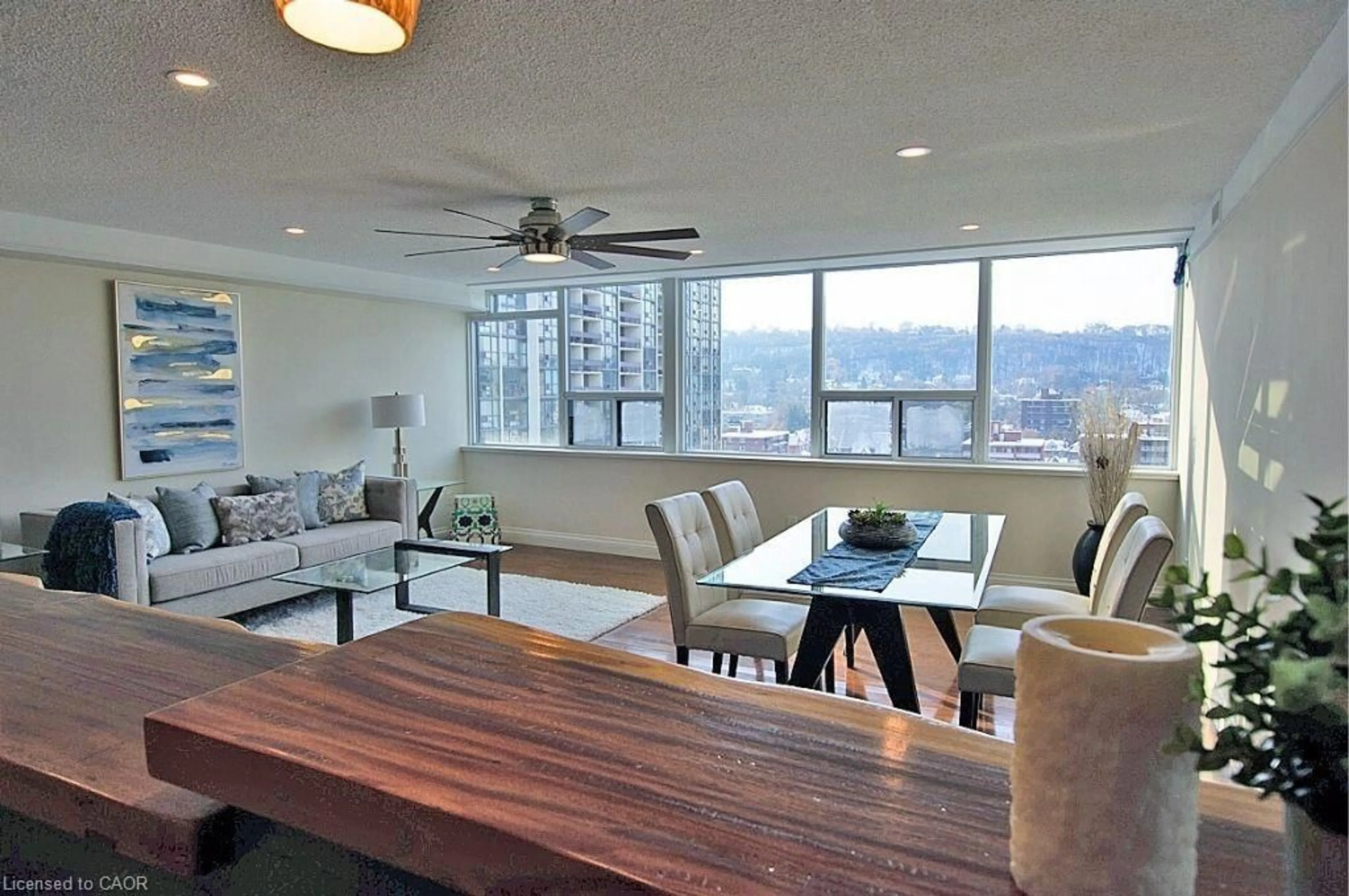 Living room with furniture, wood/laminate floor for 120 Duke St #1604, Hamilton Ontario L8P 4T1