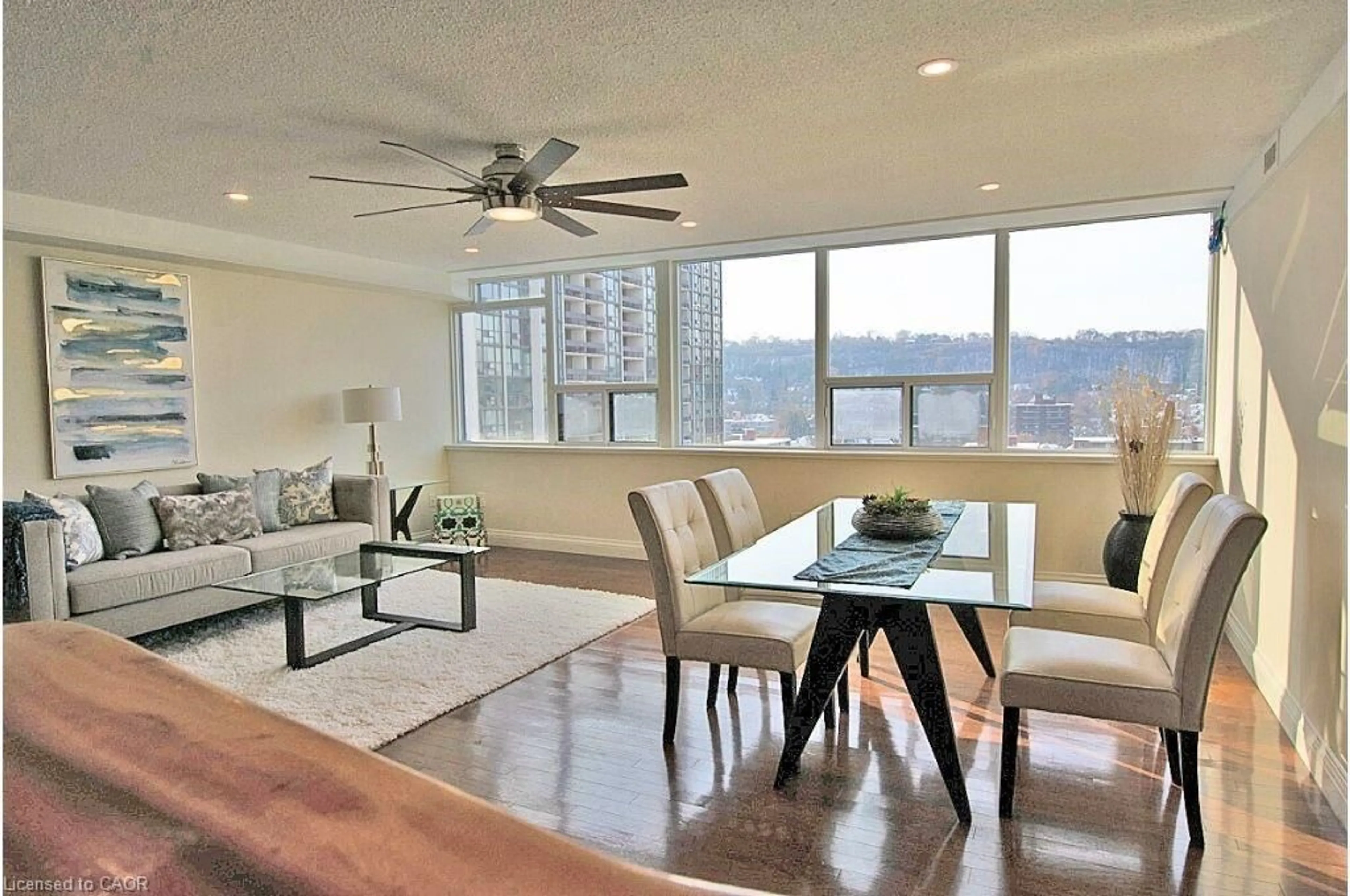 Living room with furniture, wood/laminate floor for 120 Duke St #1604, Hamilton Ontario L8P 4T1