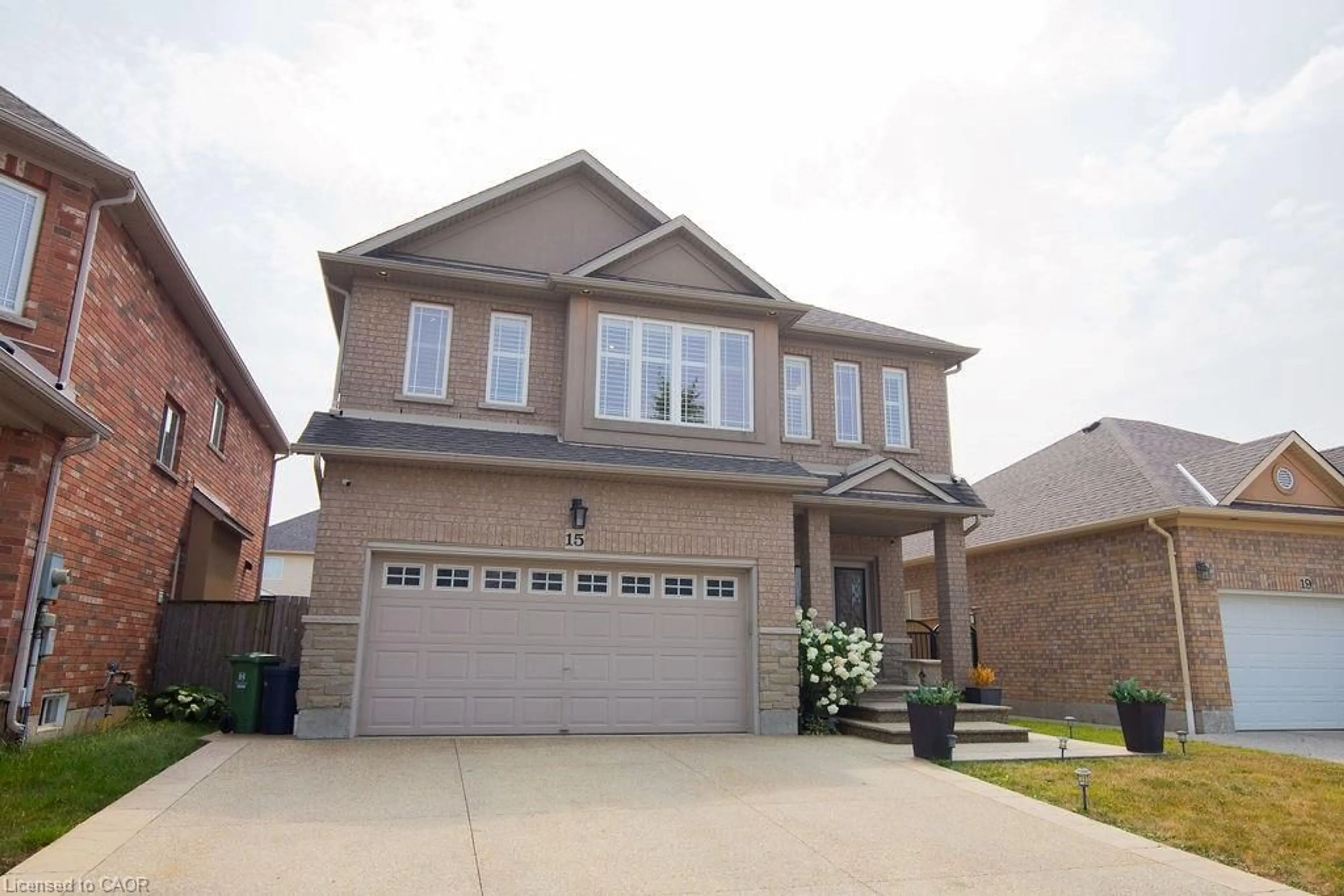 Home with brick exterior material, street for 15 Meadowbank Dr, Hamilton Ontario L9B 2Y9