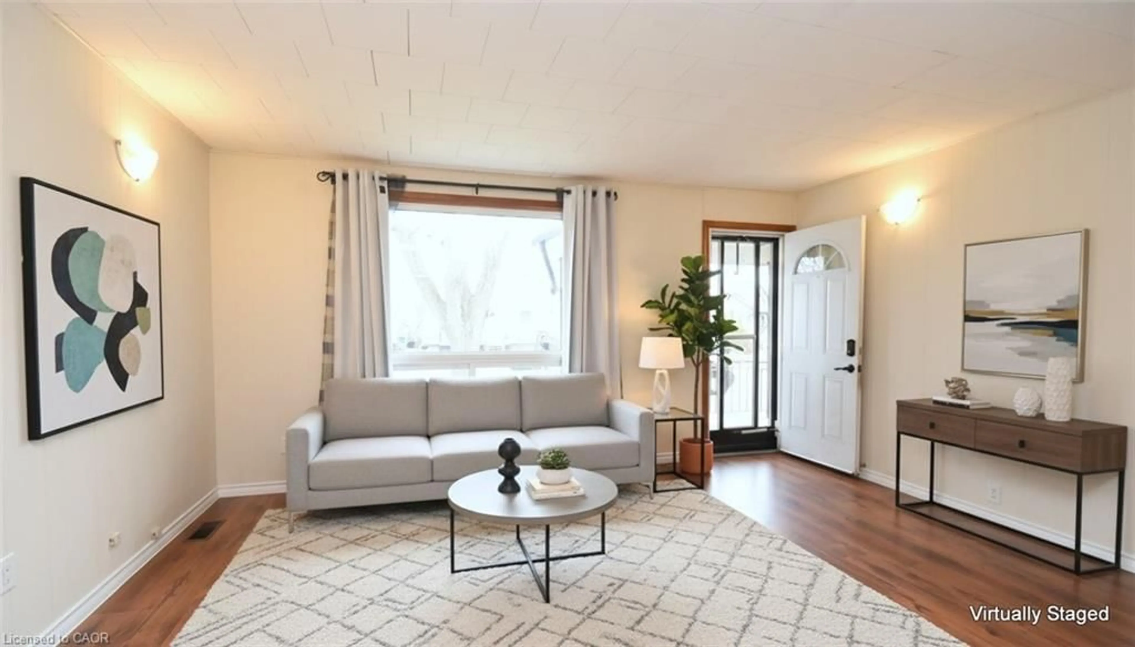 Living room with furniture, wood/laminate floor for 376 Tragina Ave, Hamilton Ontario L8H 5E5