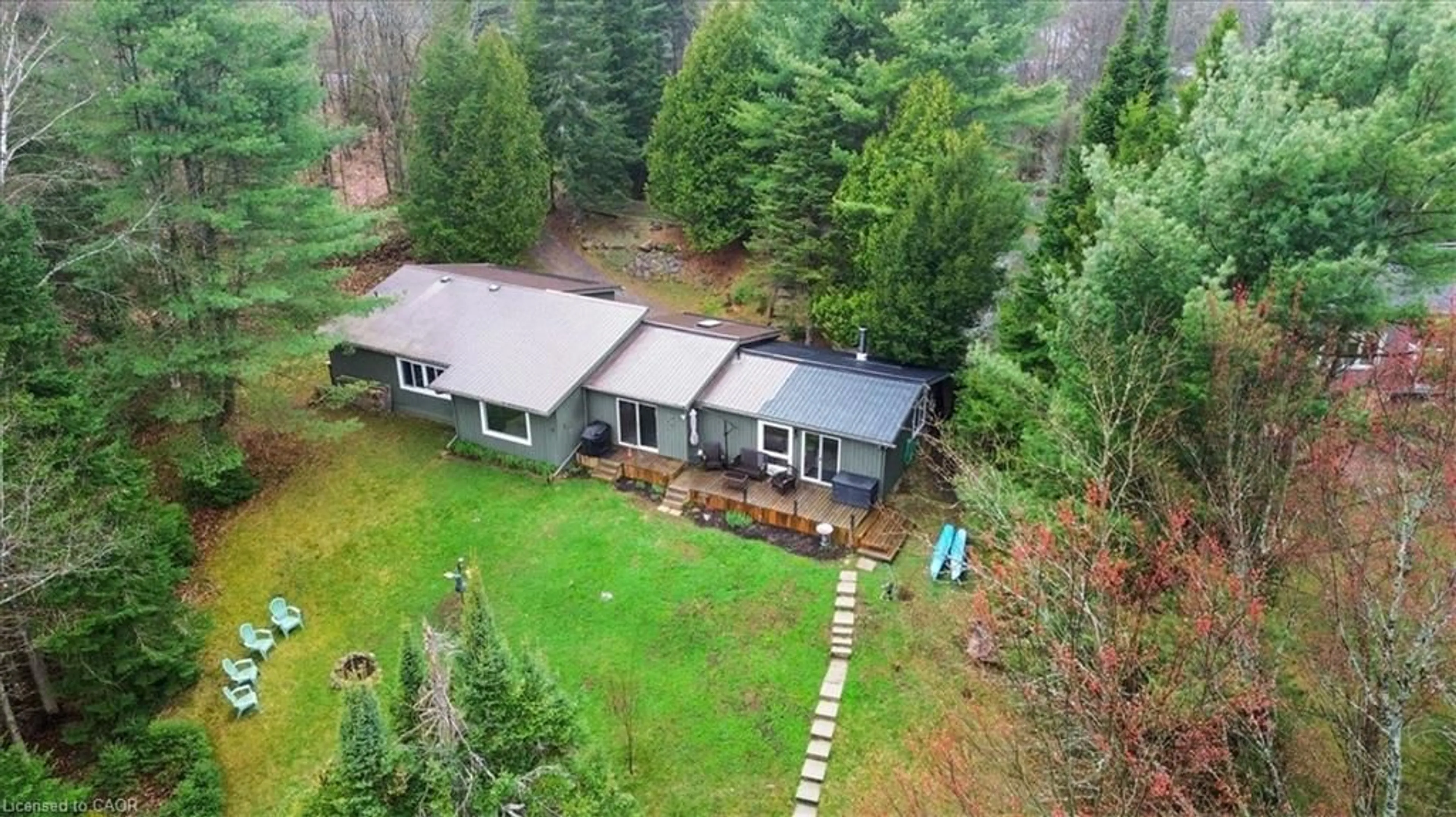 A pic from outside/outdoor area/front of a property/back of a property/a pic from drone, forest/trees view for 1017 Rays Lane, Minden Ontario K0M 2K0