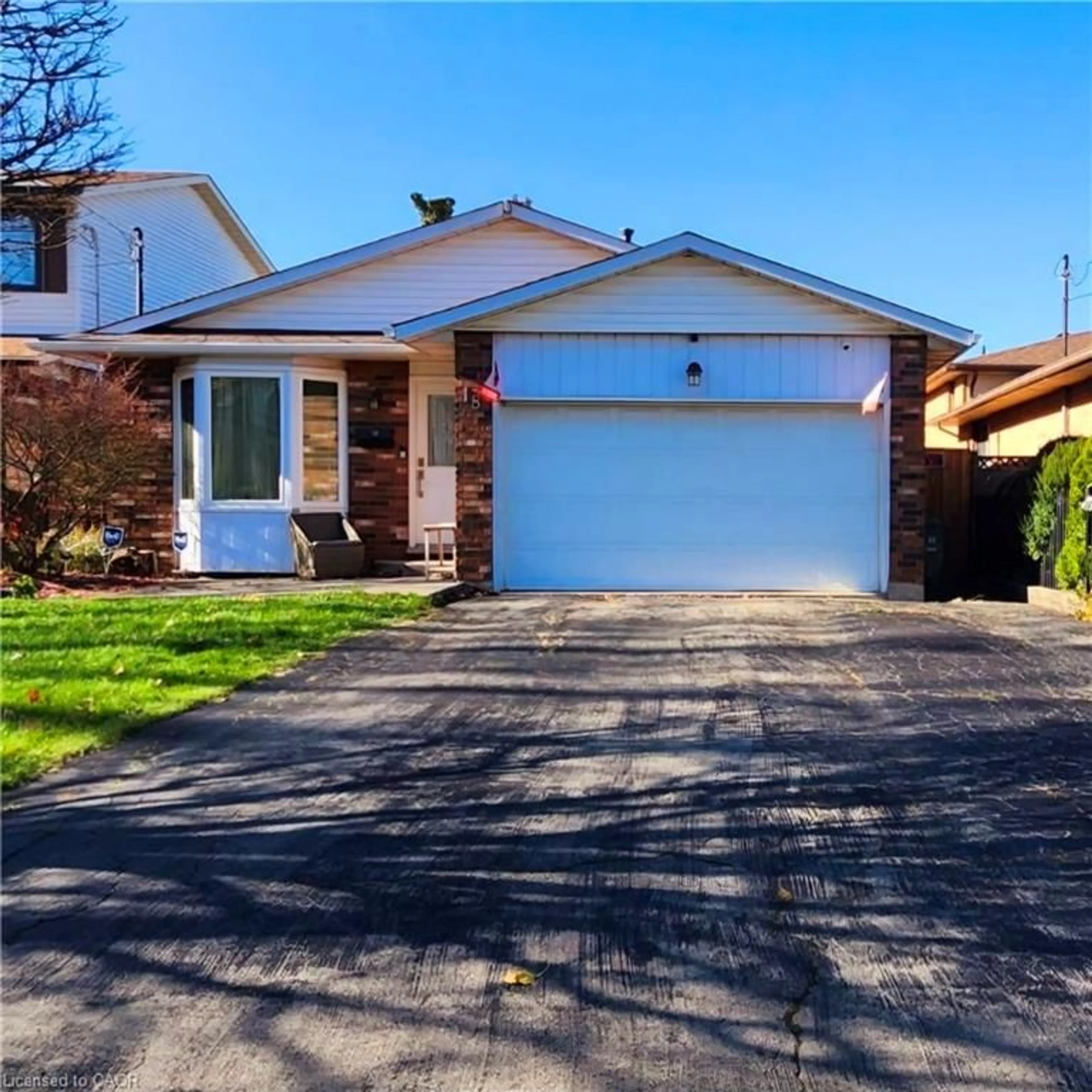 Home with brick exterior material, street for 18 Rosewell St, Hamilton Ontario L8W 2L1