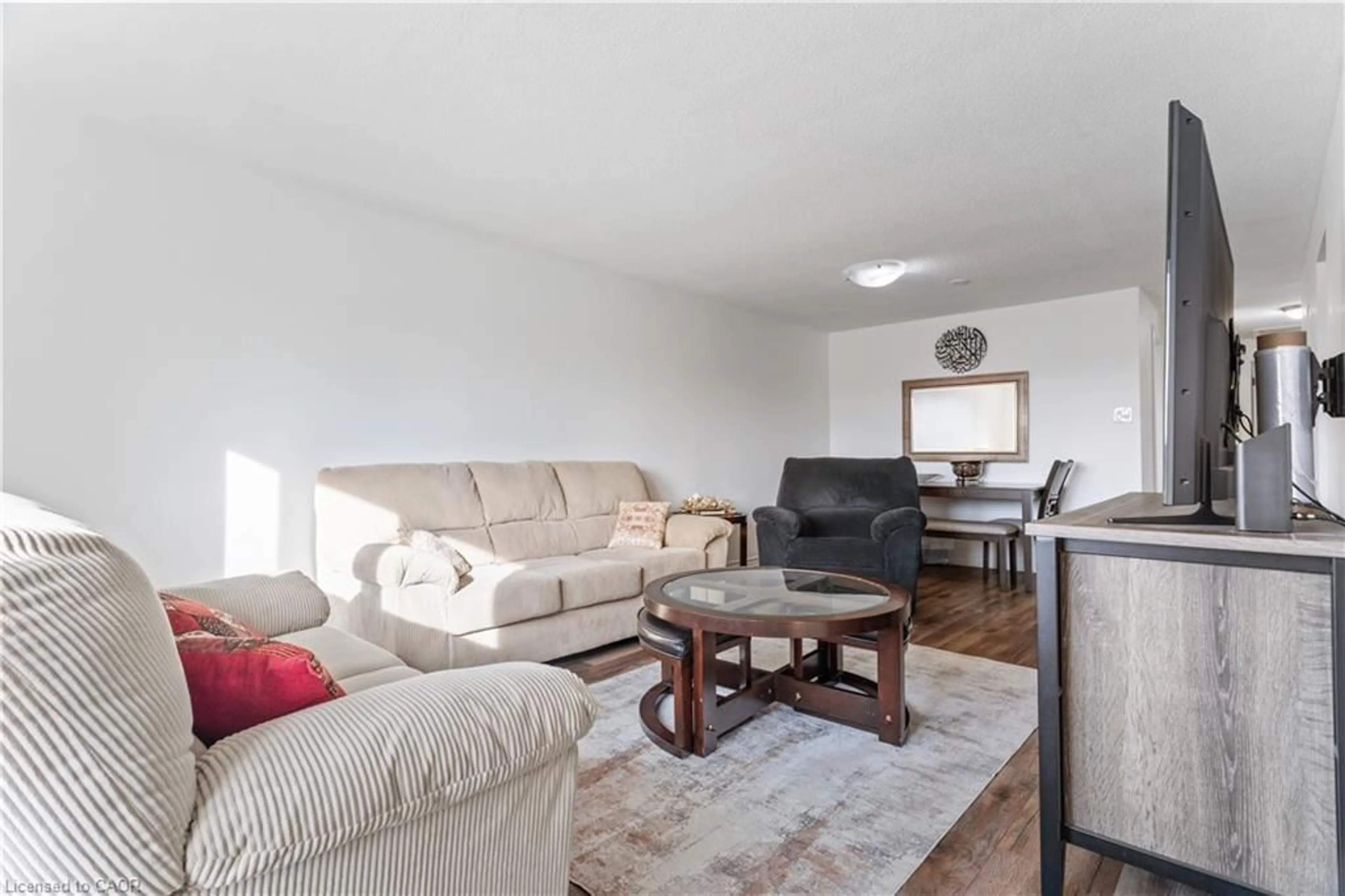 Living room with furniture, wood/laminate floor for 23 Greenbrier Rd, Cambridge Ontario N1R 6M5