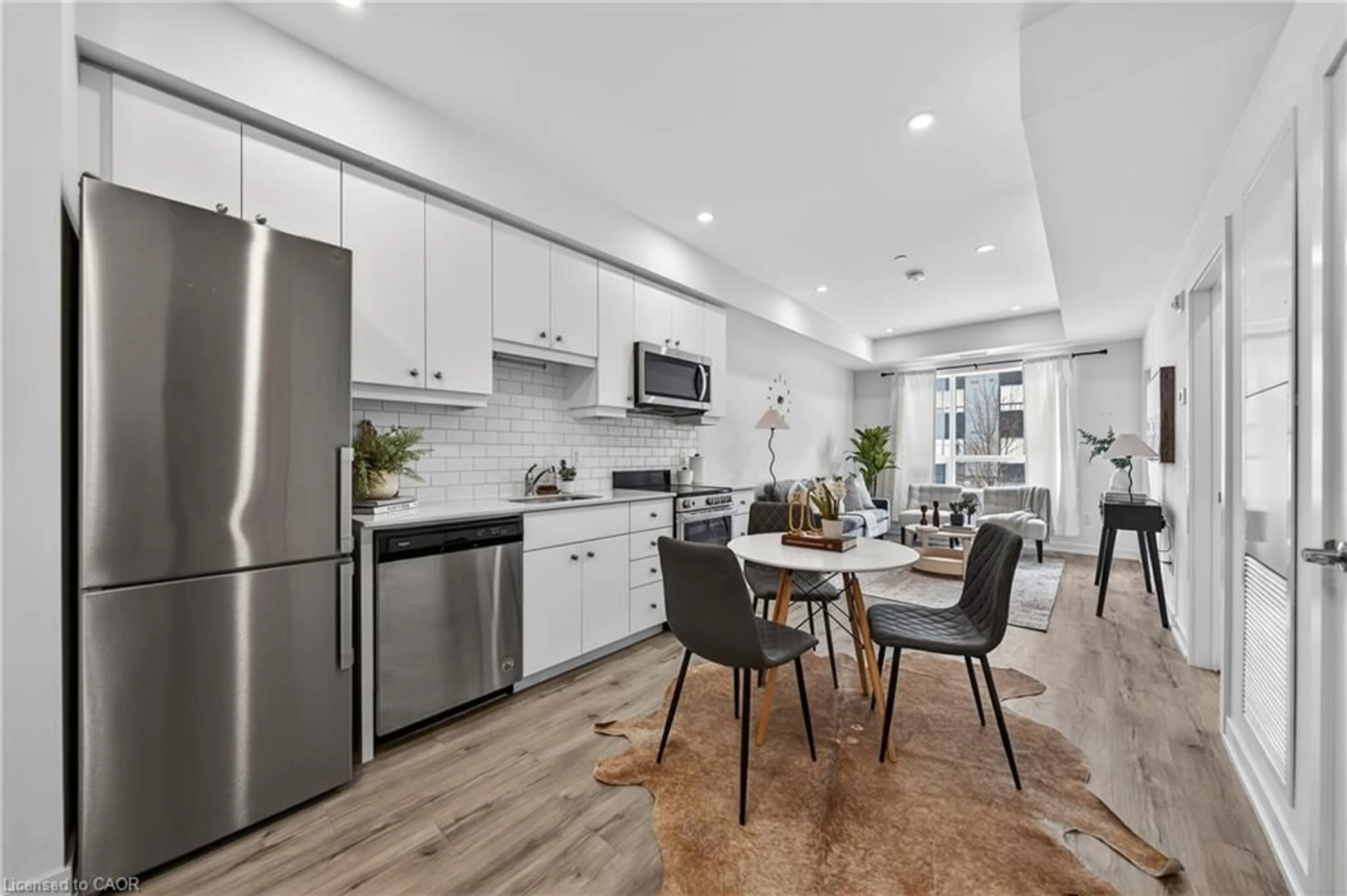 Open concept kitchen, ceramic/tile floor for 247 Northfield Dr #210, Waterloo Ontario N2K 0H1