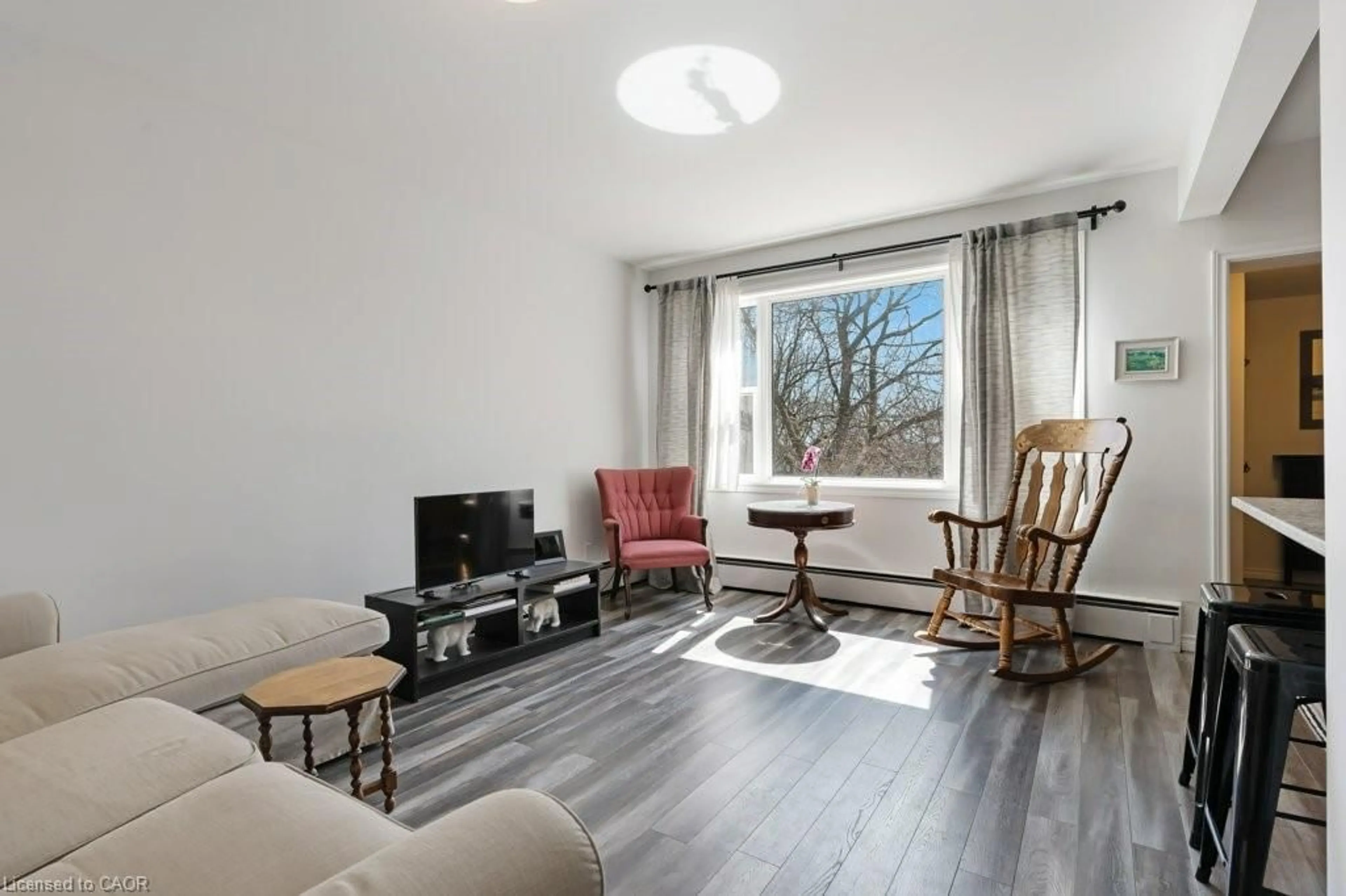Living room with furniture, wood/laminate floor for 97 St George St, Kitchener Ontario N2G 2T2