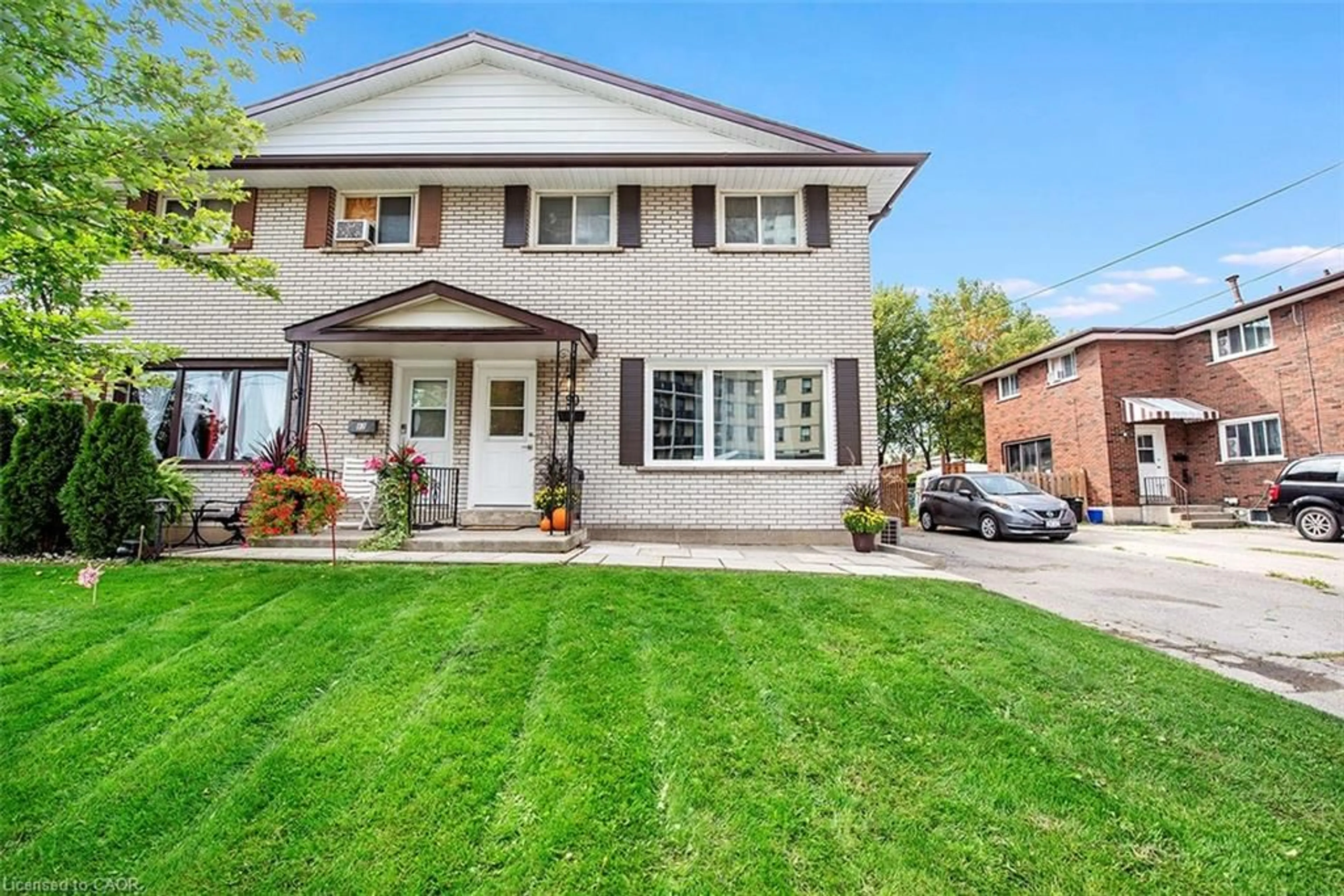 Home with brick exterior material, street for 56 & 58 Delawana Dr, Hamilton Ontario L8E 1G4