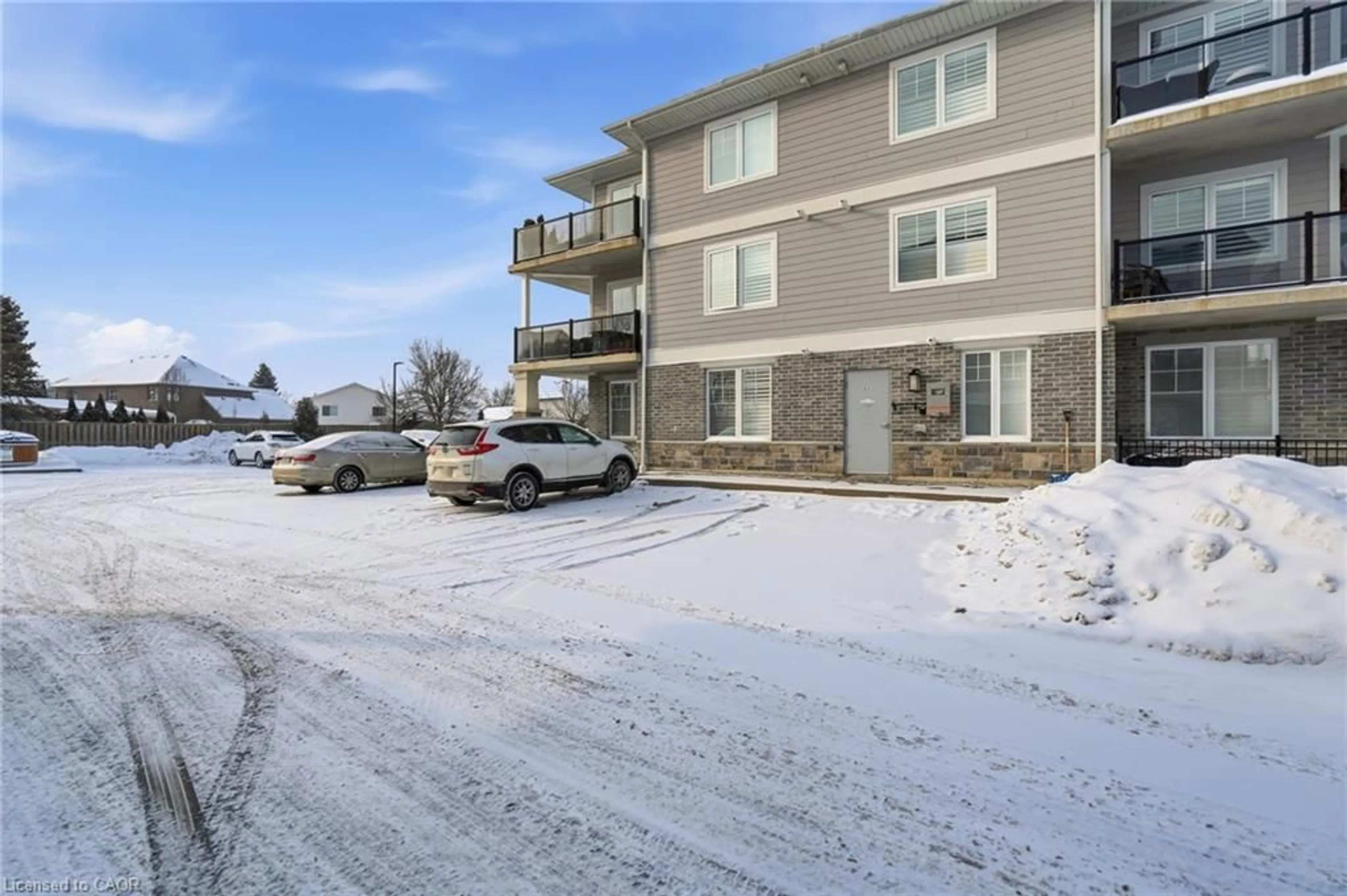 A pic from outside/outdoor area/front of a property/back of a property/a pic from drone, unknown for 65 Haddington St #207, Caledonia Ontario N3W 2H2