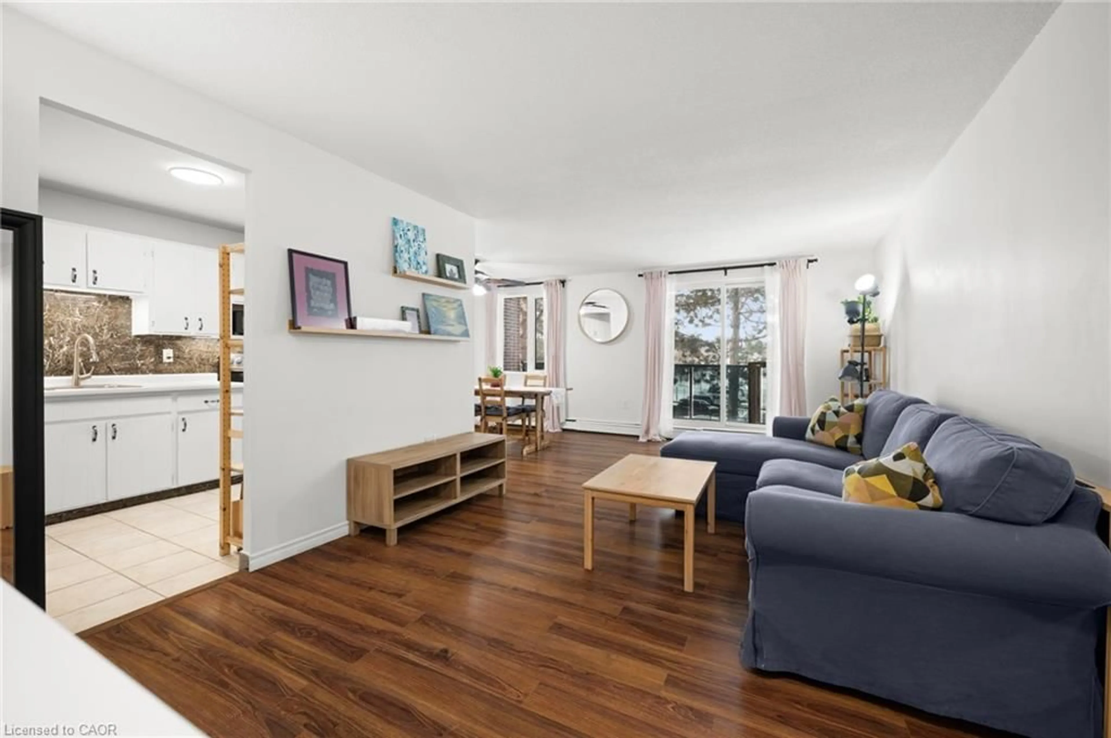 Living room with furniture, wood/laminate floor for 279 Chandler Dr #203, Kitchener Ontario N2E 1X6