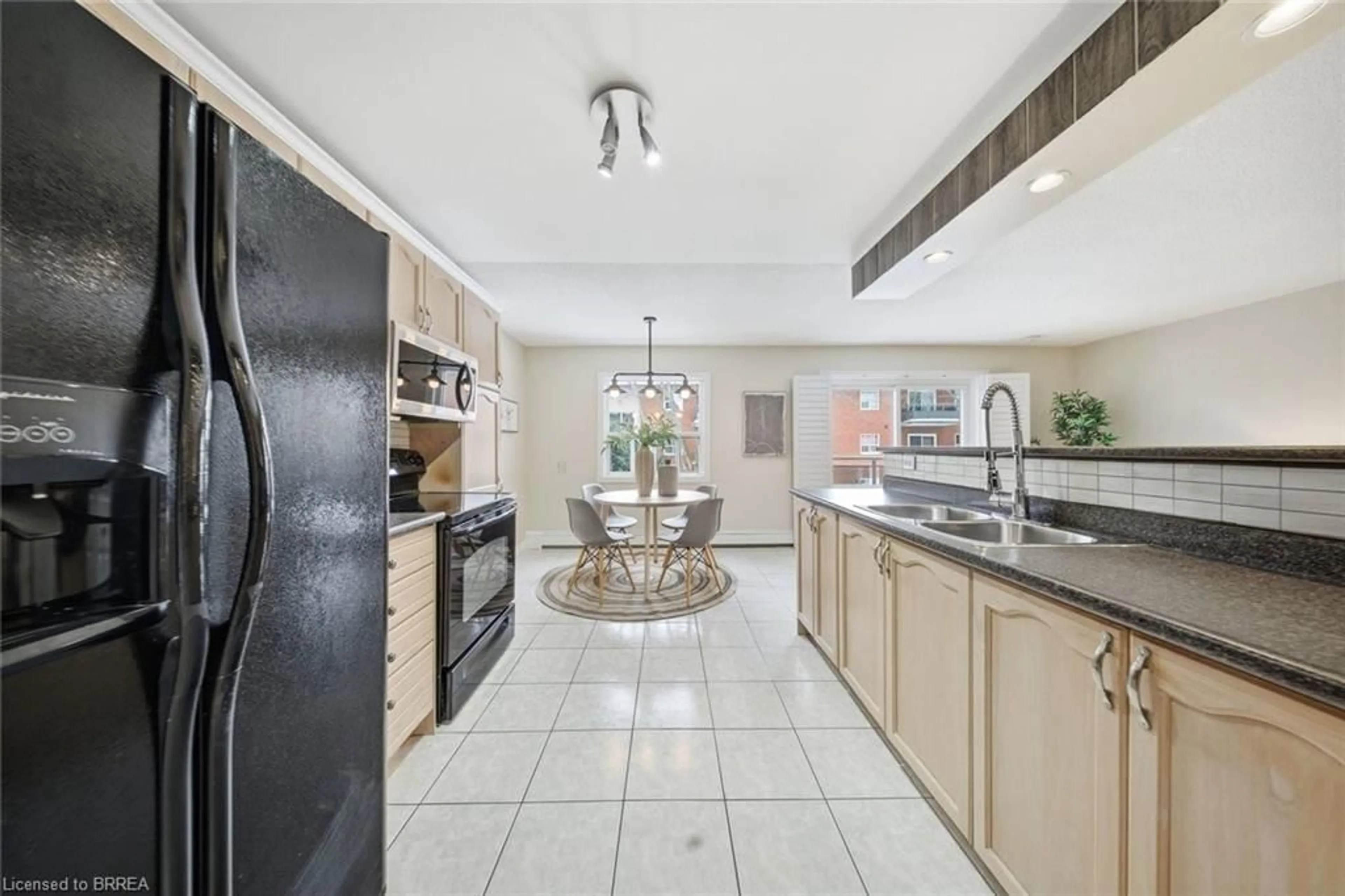 Open concept kitchen, ceramic/tile floor for 616 Grey St #16, Brantford Ontario N3S 4Y1