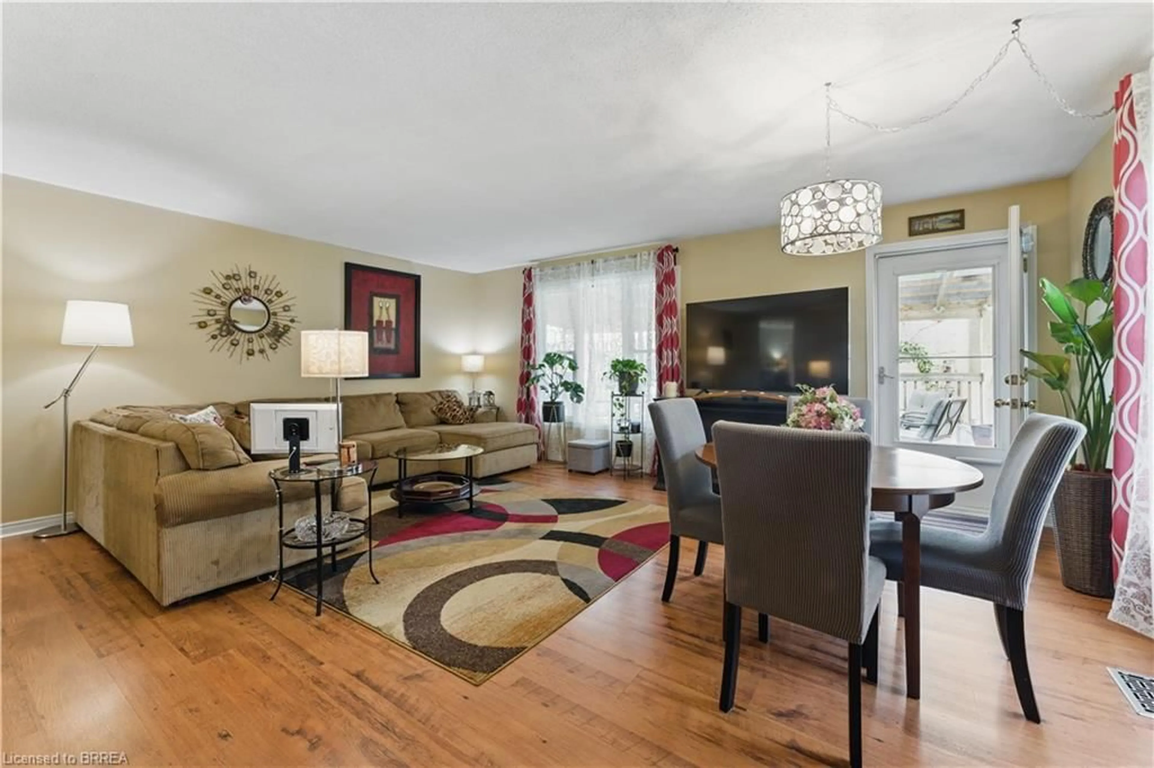 Living room with furniture, wood/laminate floor for 13 King William St, St. George Ontario N0E 1N0