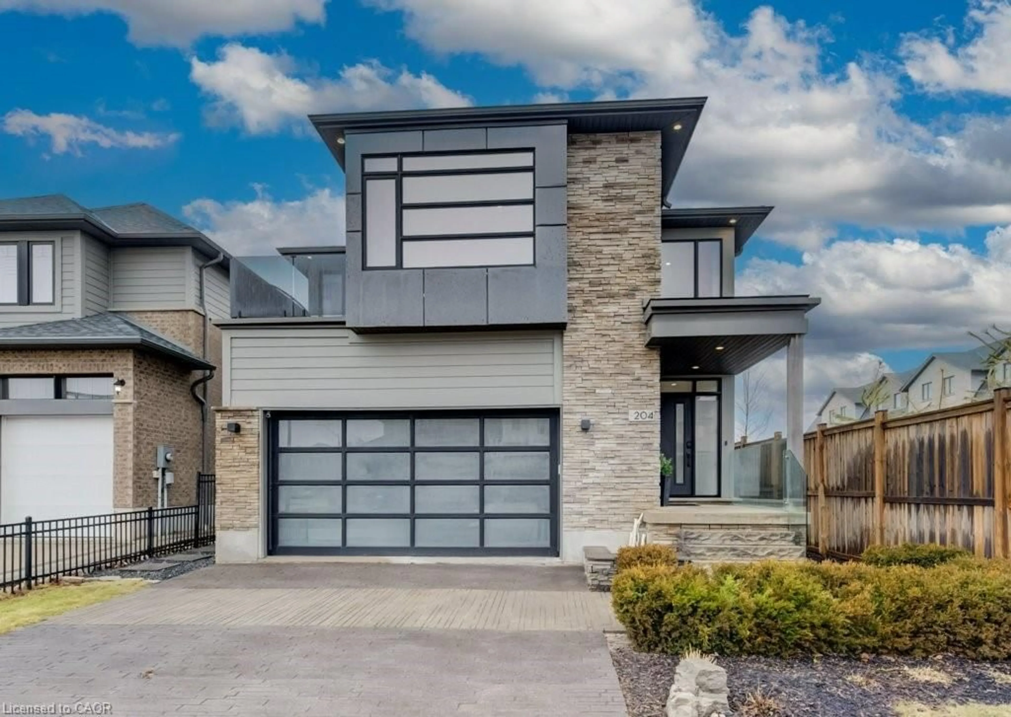 Home with brick exterior material, street for 204 Carriage Way, Waterloo Ontario N2K 0C6