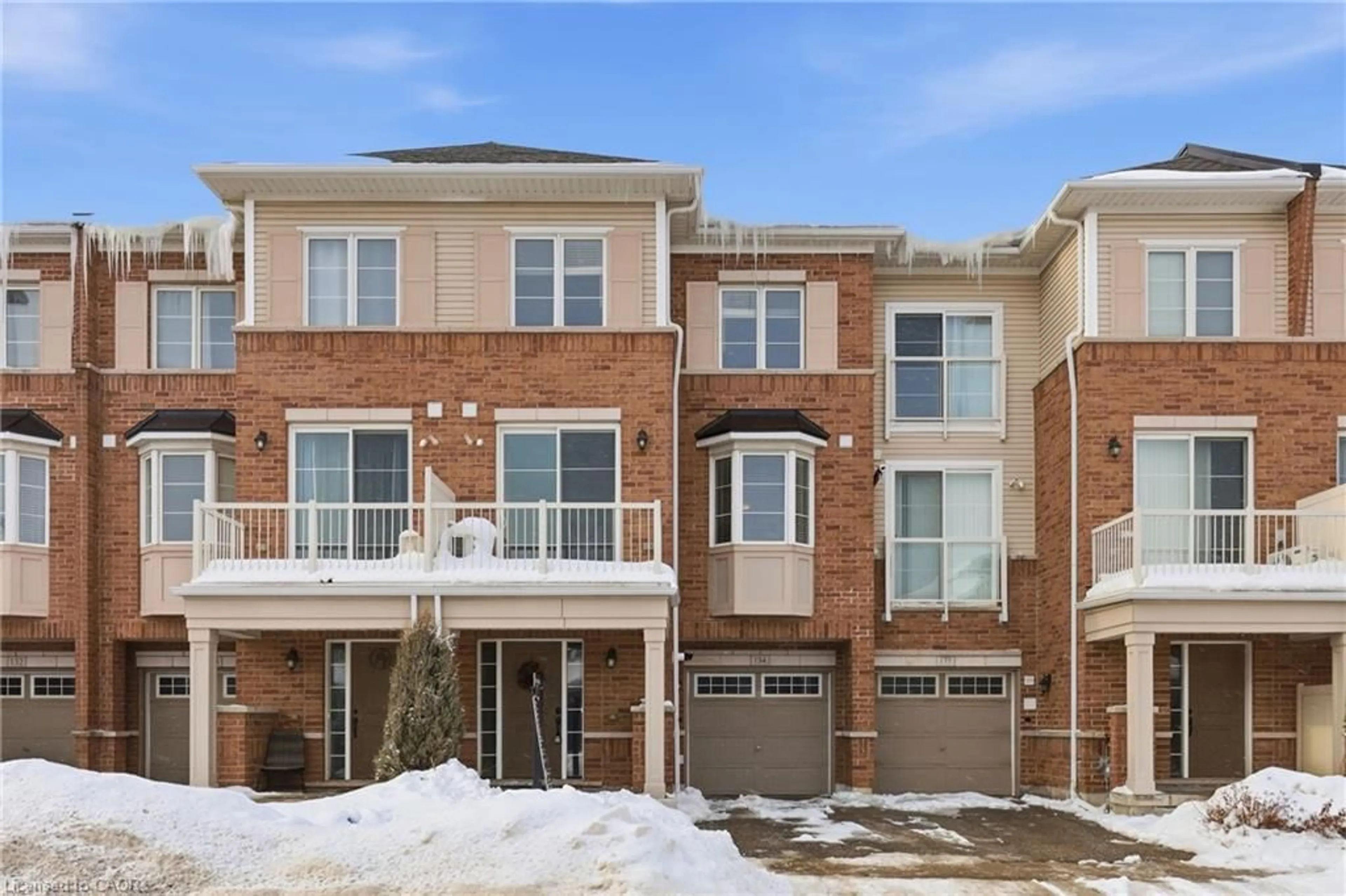Home with brick exterior material, street for 165 Hampshire Way #134, Milton Ontario L9T 8M7