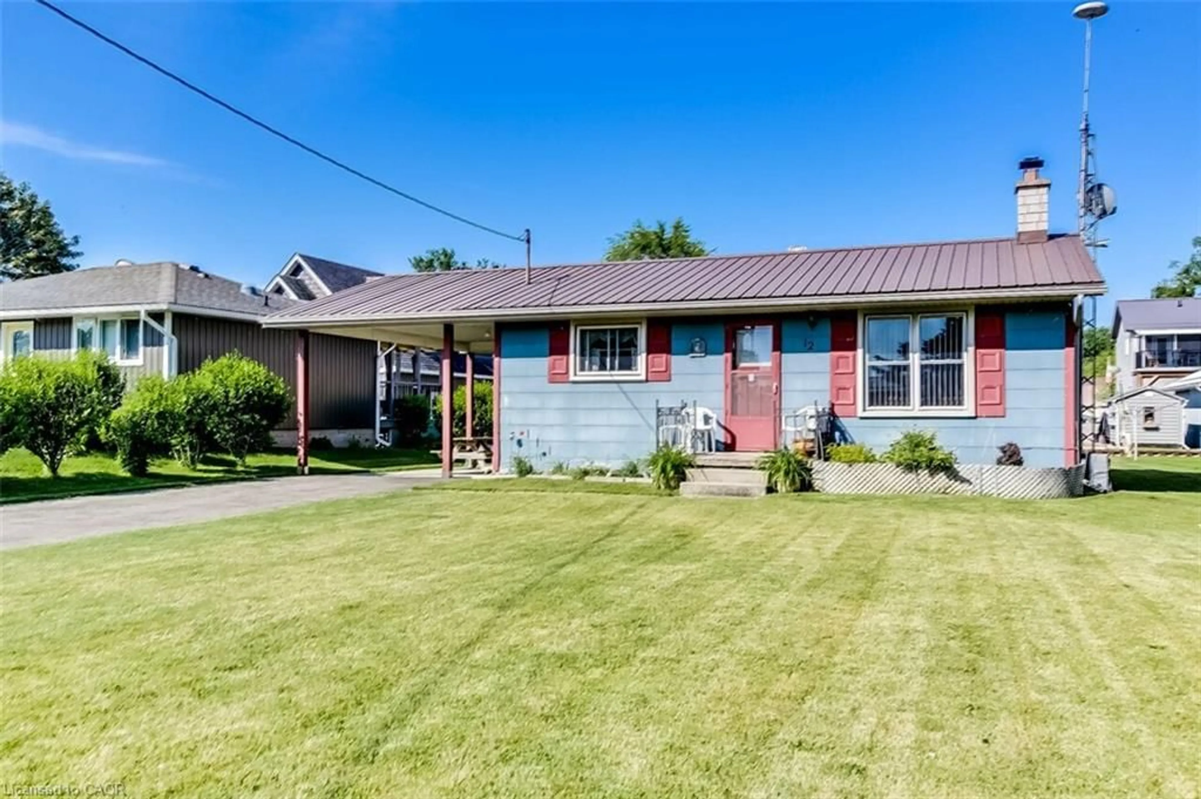 Home with brick exterior material, street for 12 Willow Ave, Long Point Ontario N0E 1M0