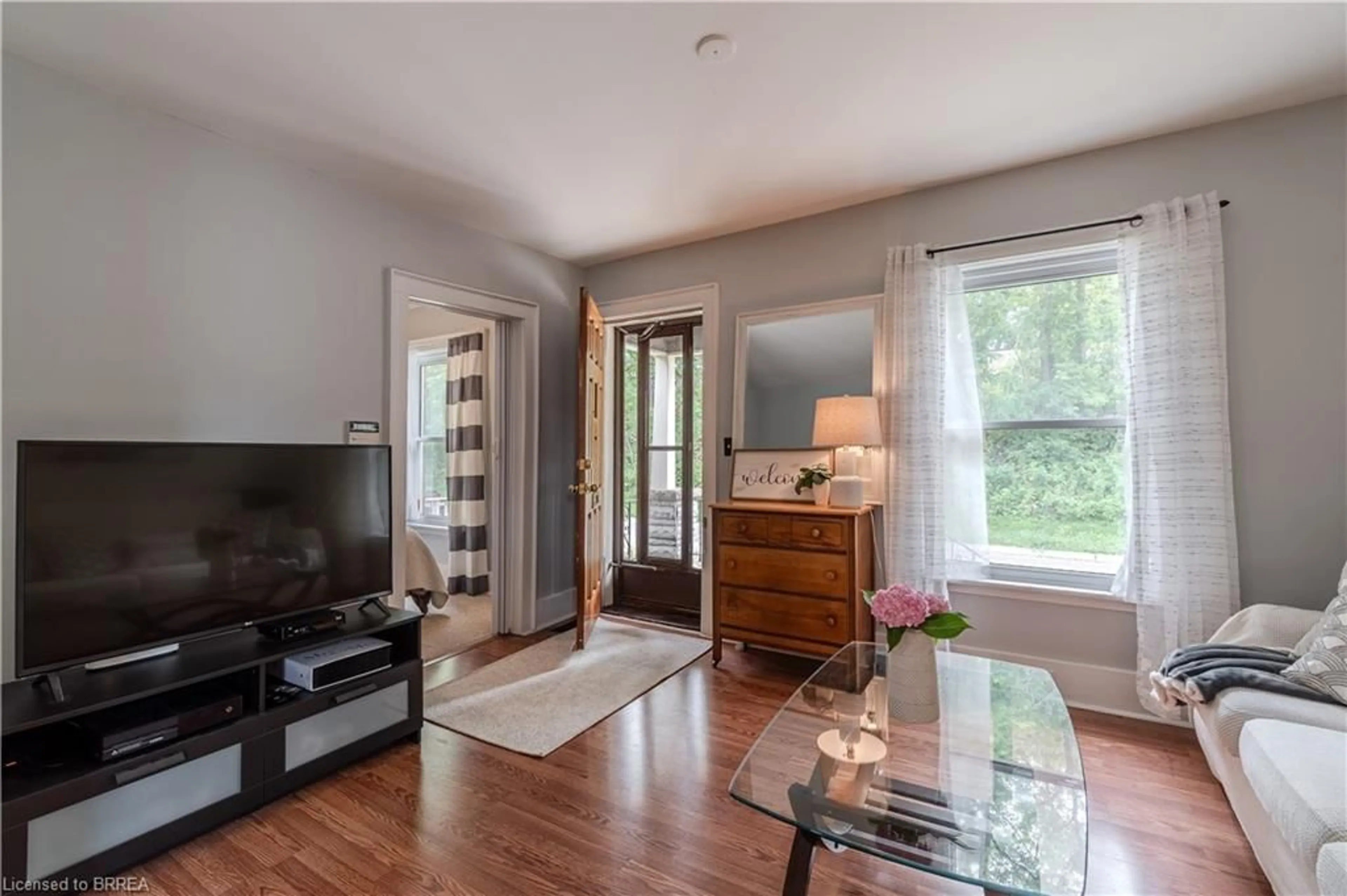 Living room with furniture, wood/laminate floor for 182 Durham St, Brantford Ontario N3S 4Y7