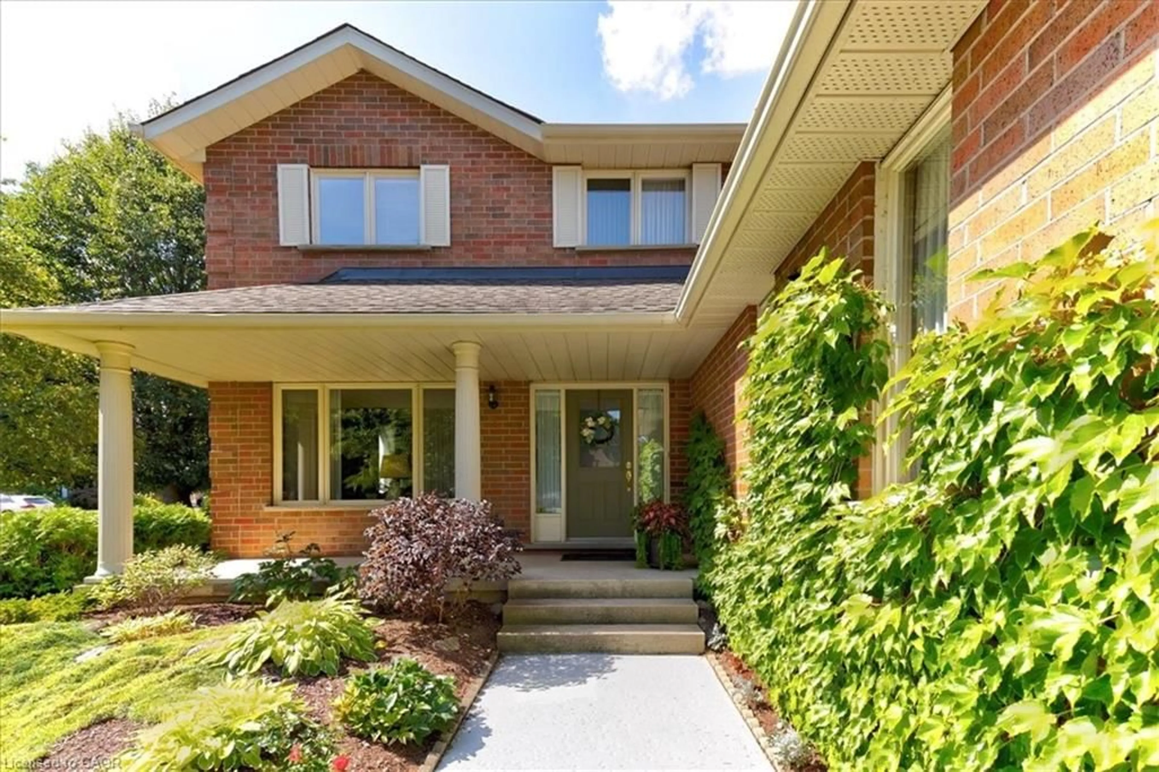 Home with brick exterior material, street for 599 Stonebury Cres, Waterloo Ontario N2K 3R2