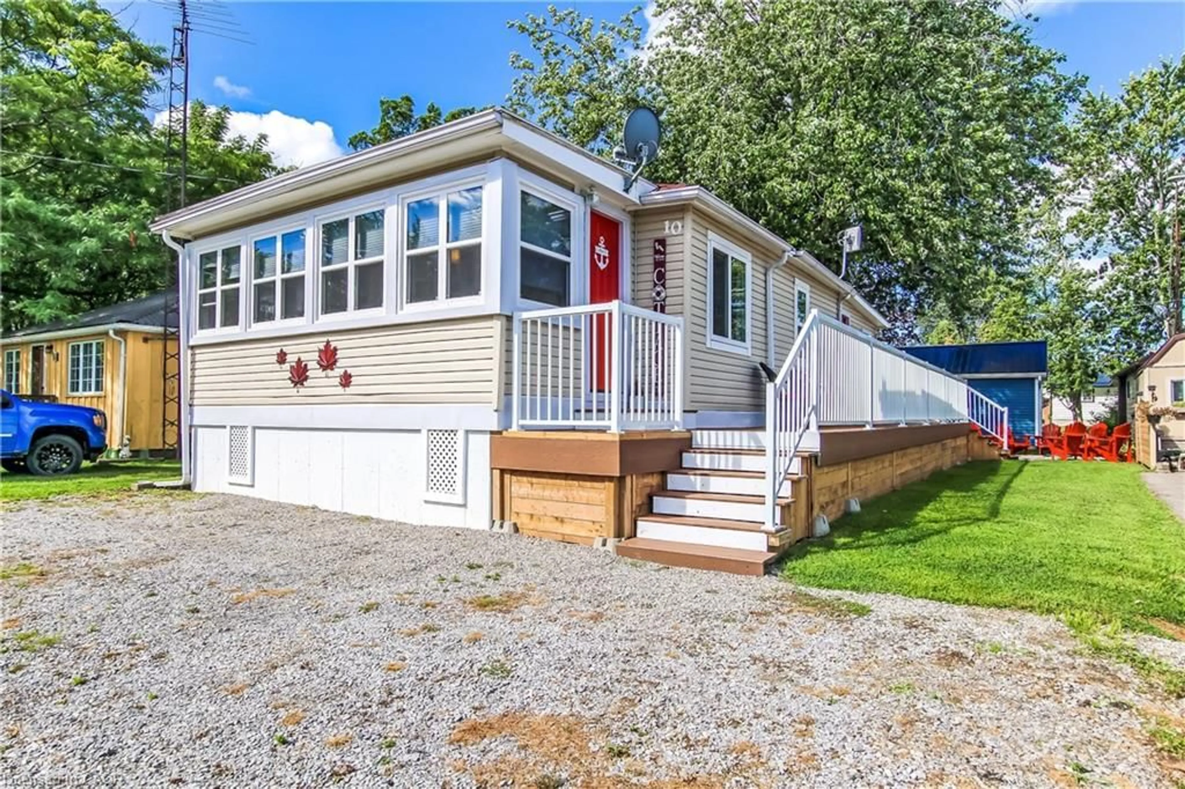 Home with vinyl exterior material, street for 10 Fourth Ave, Long Point Ontario N0E 1M0