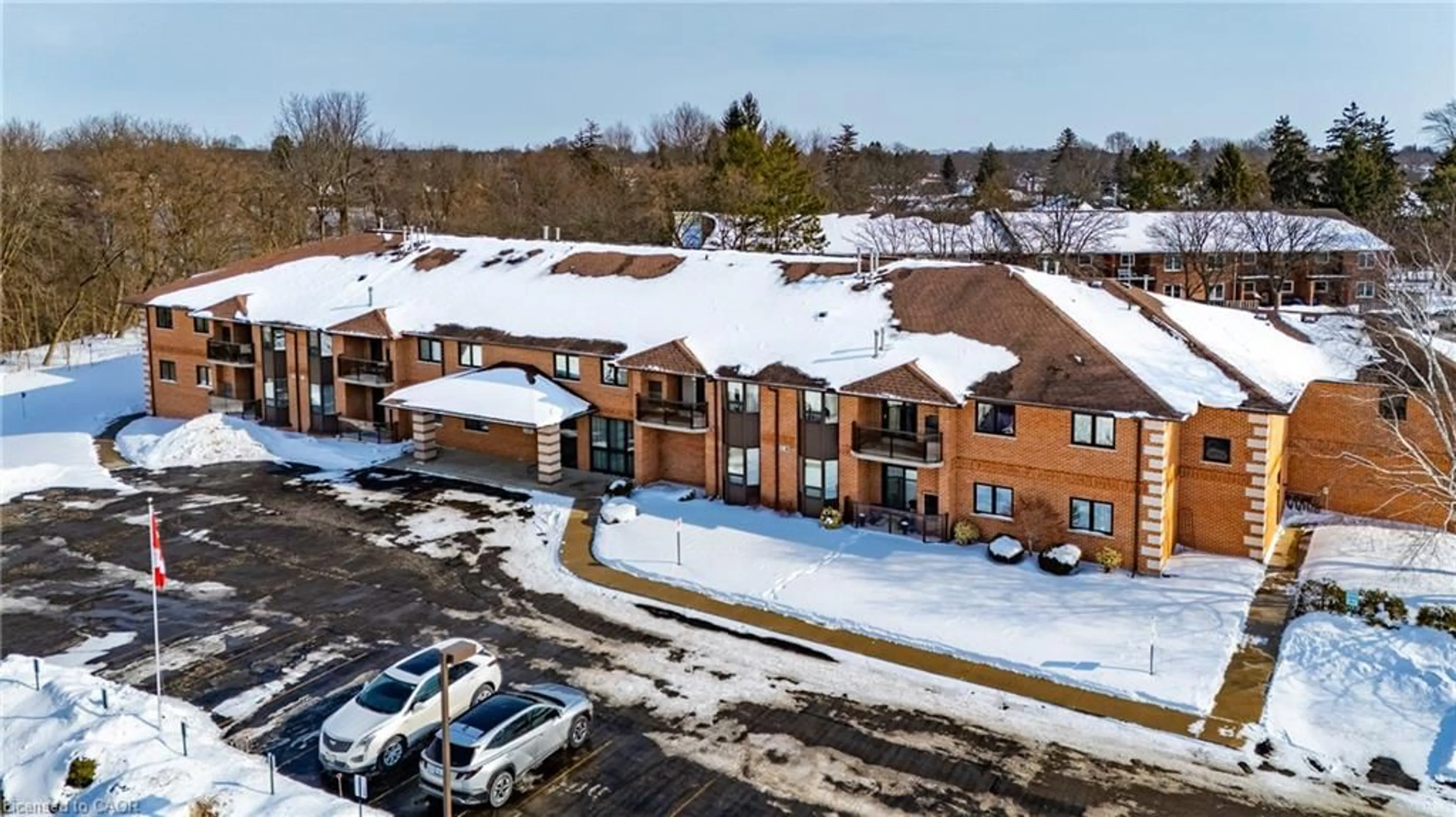 A pic from outside/outdoor area/front of a property/back of a property/a pic from drone, building for 303 William St #103, Delhi Ontario N4B 1N1