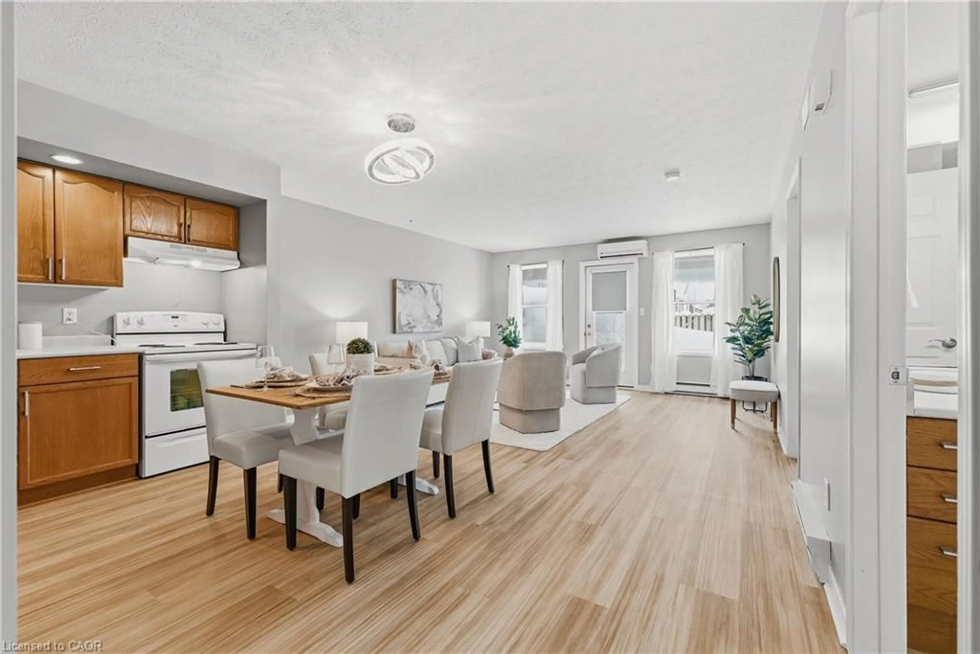 Open concept kitchen, wood/laminate floor for 1028 Ann St #10, Wroexeter Ontario N0G 2X0