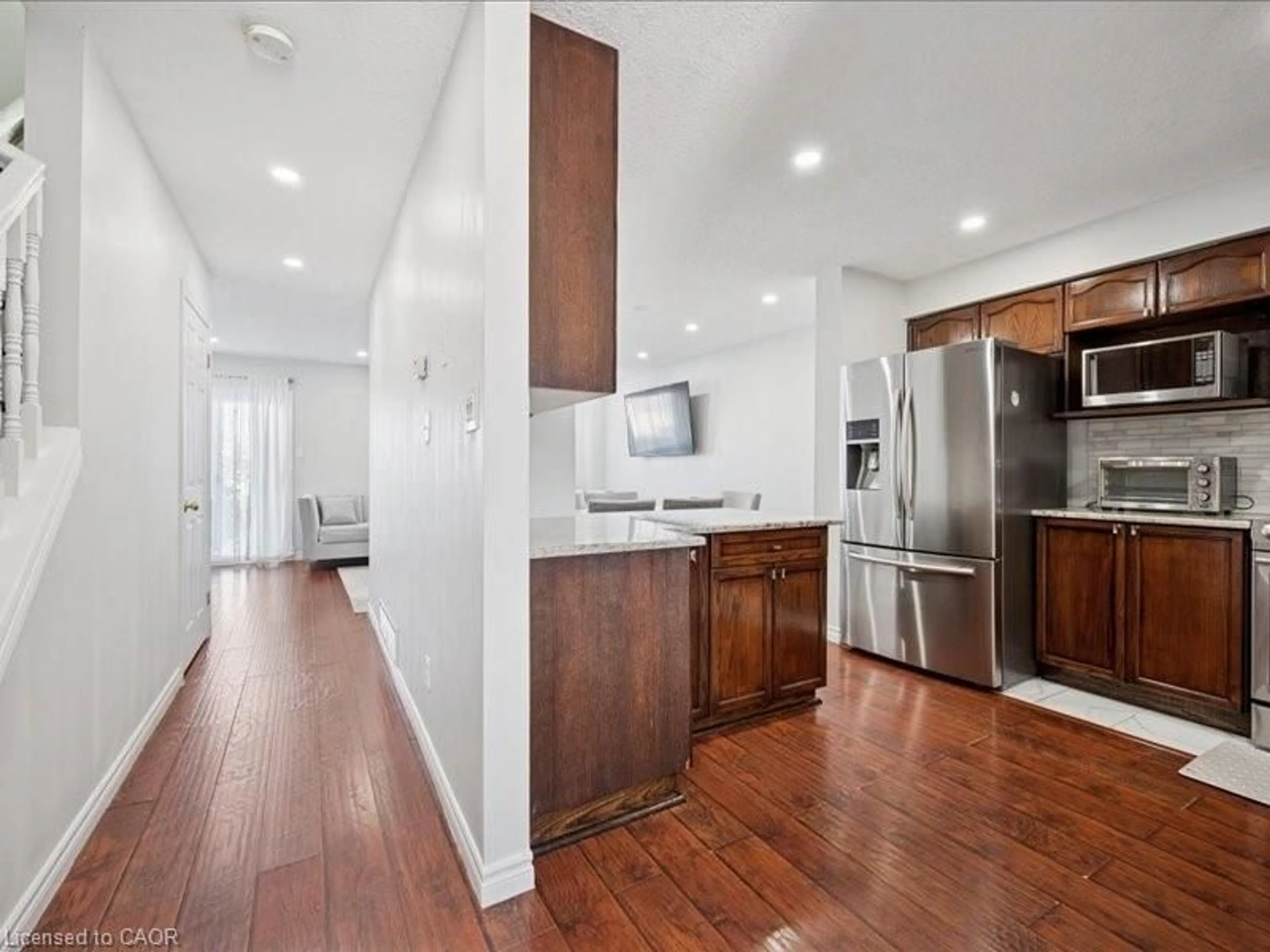 Open concept kitchen, wood/laminate floor for 82 Ralgreen Cres, Kitchener Ontario N2M 1T9