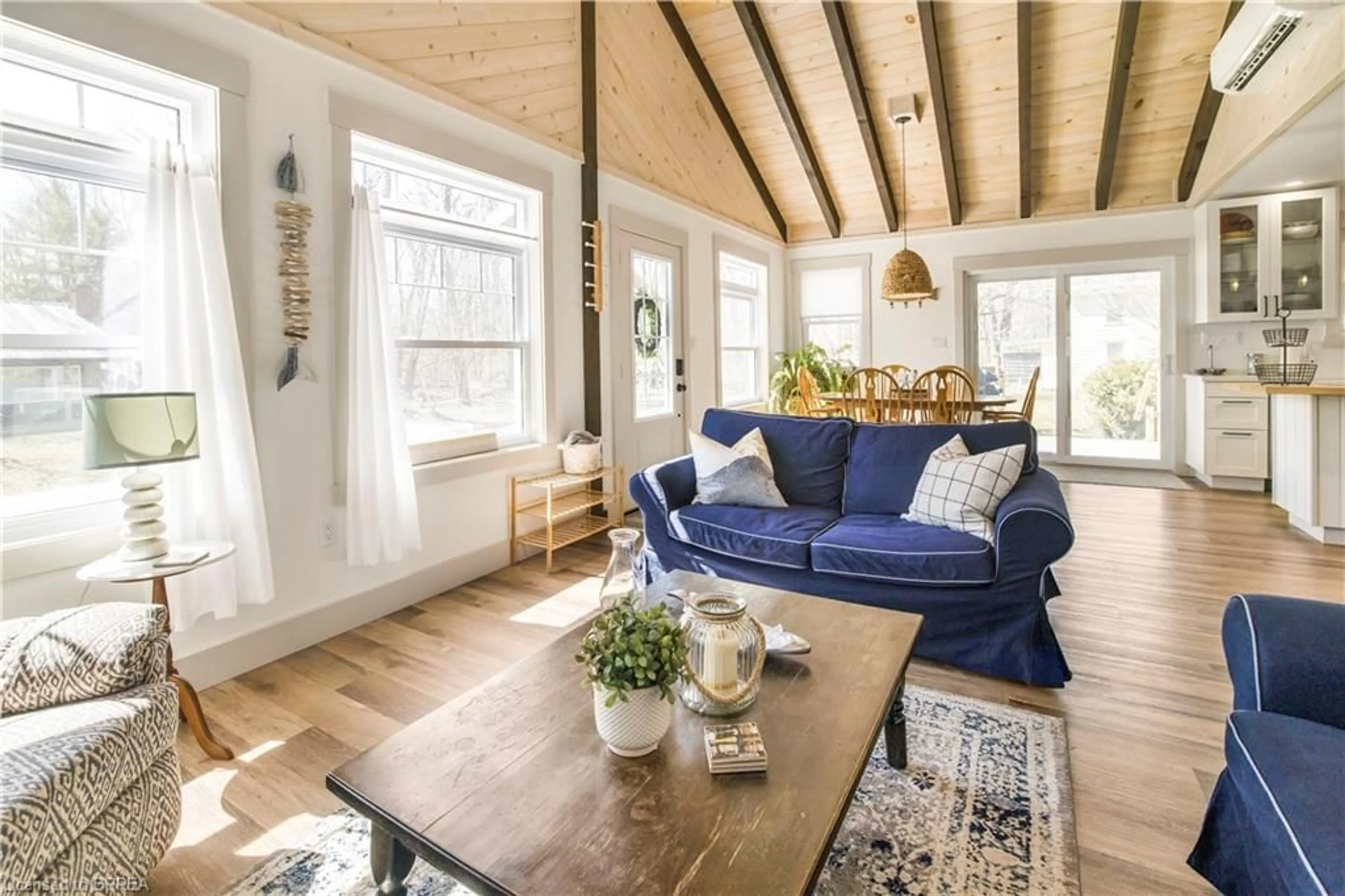 Living room with furniture, wood/laminate floor for 7 Pellum St, Turkey Point Ontario N0E 1T0