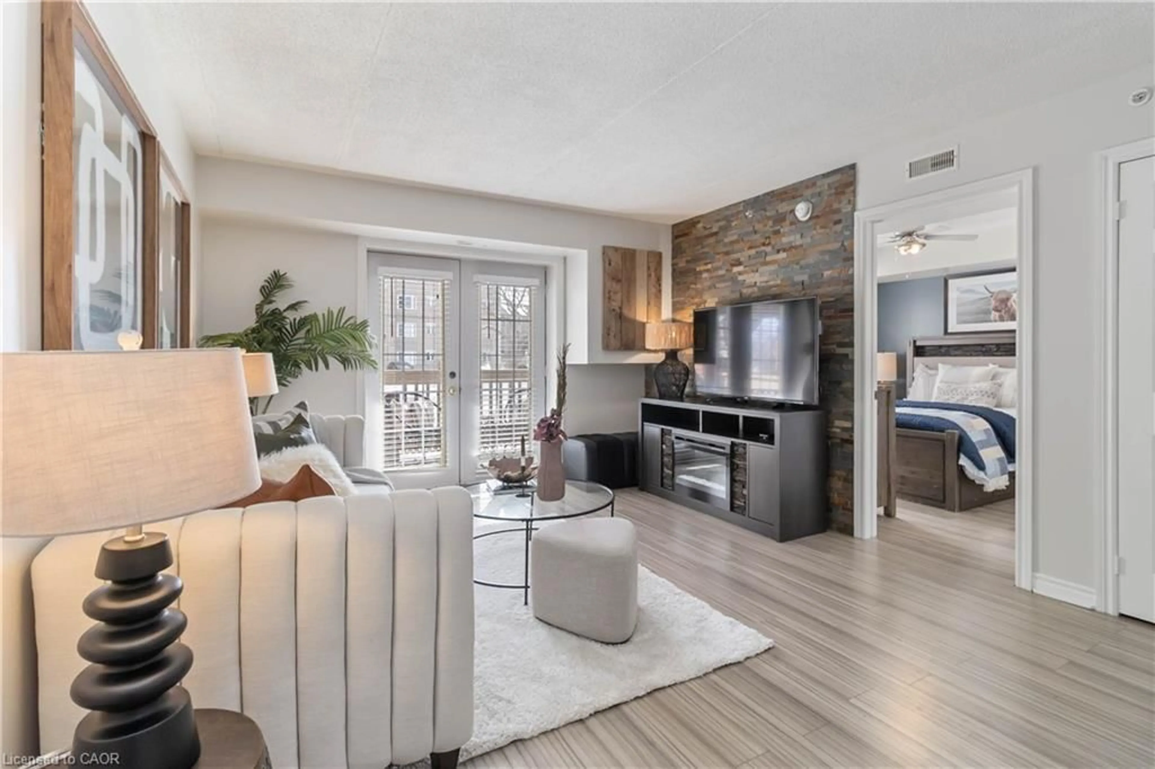 Living room with furniture, unknown for 4015 Kilmer Dr #110, Burlington Ontario L7M 4M4