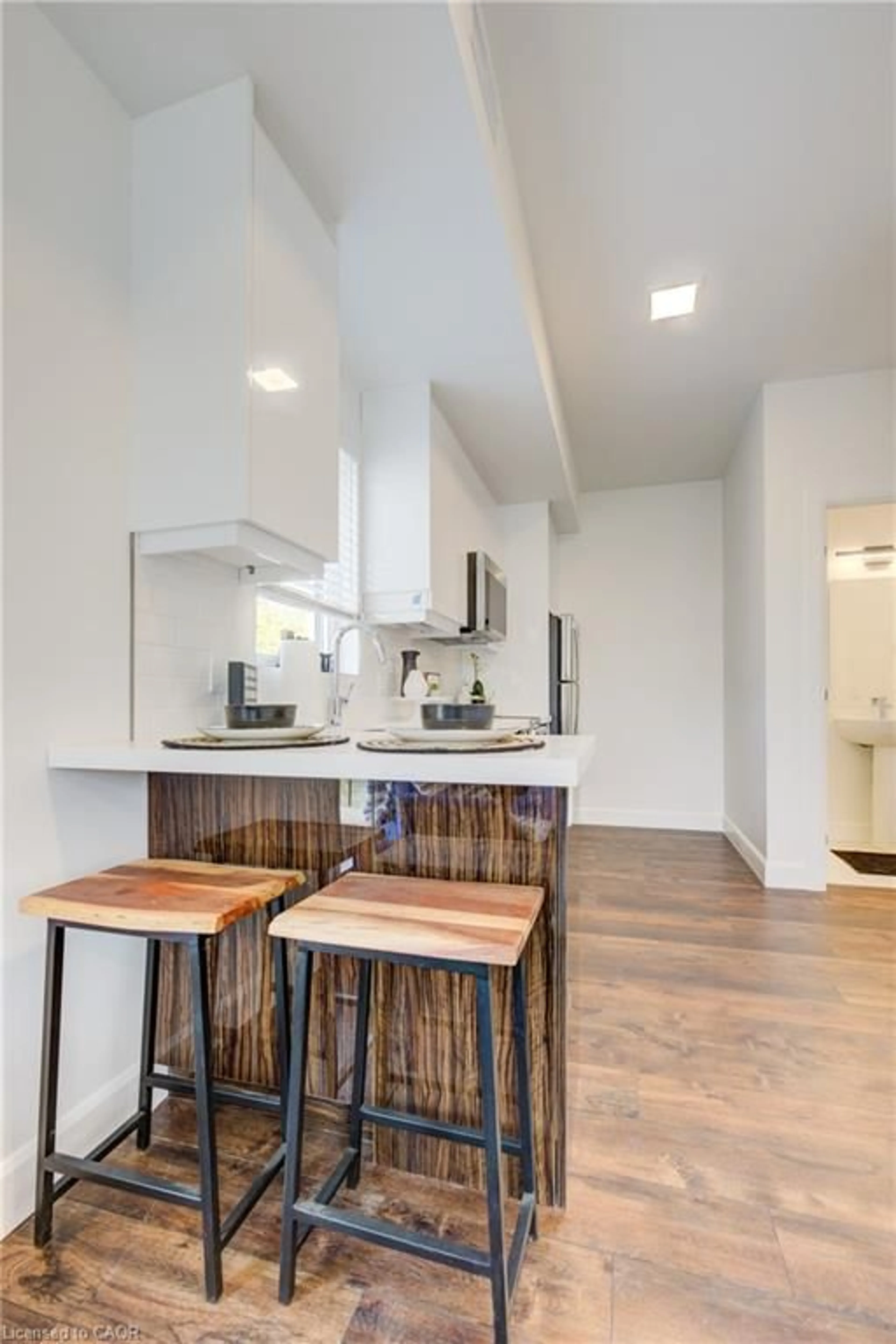 Open concept kitchen, wood/laminate floor for 132 Woolwich St #215, Kitchener Ontario N2K 0H9