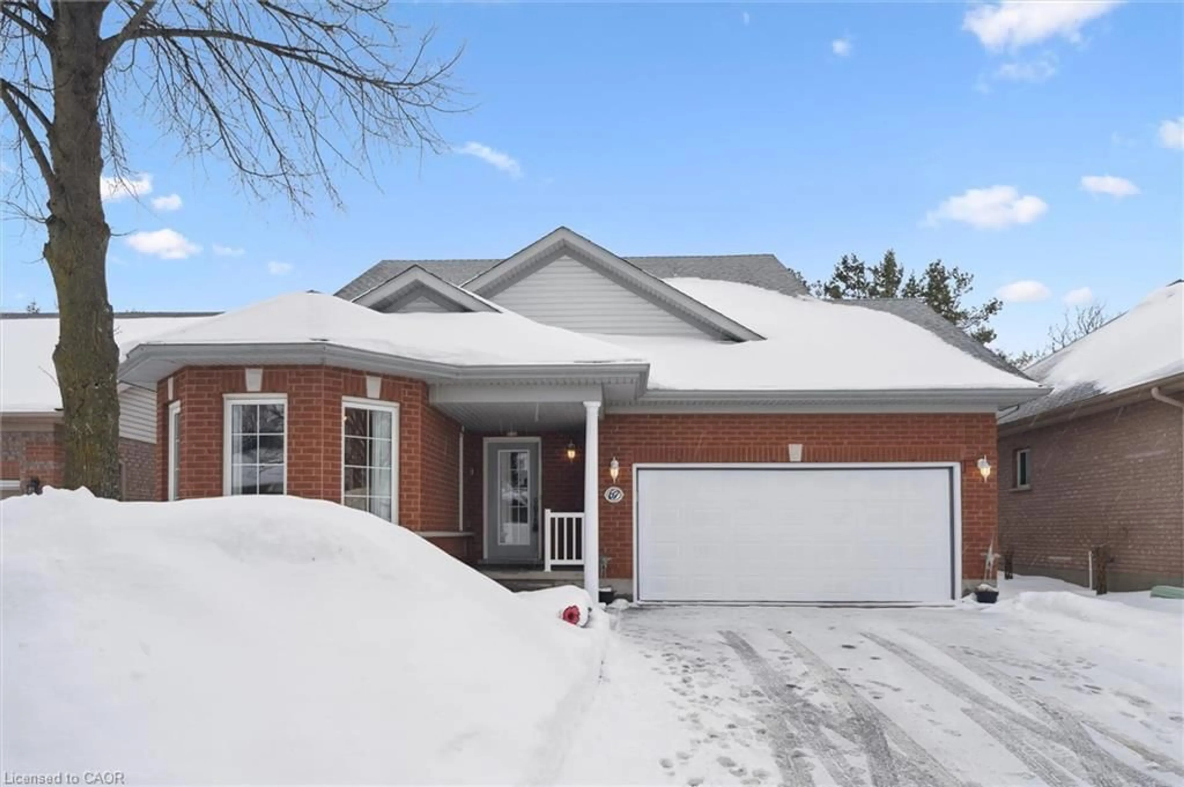 Home with brick exterior material, street for 67 Whitepine Way, Guelph Ontario N1G 4X7