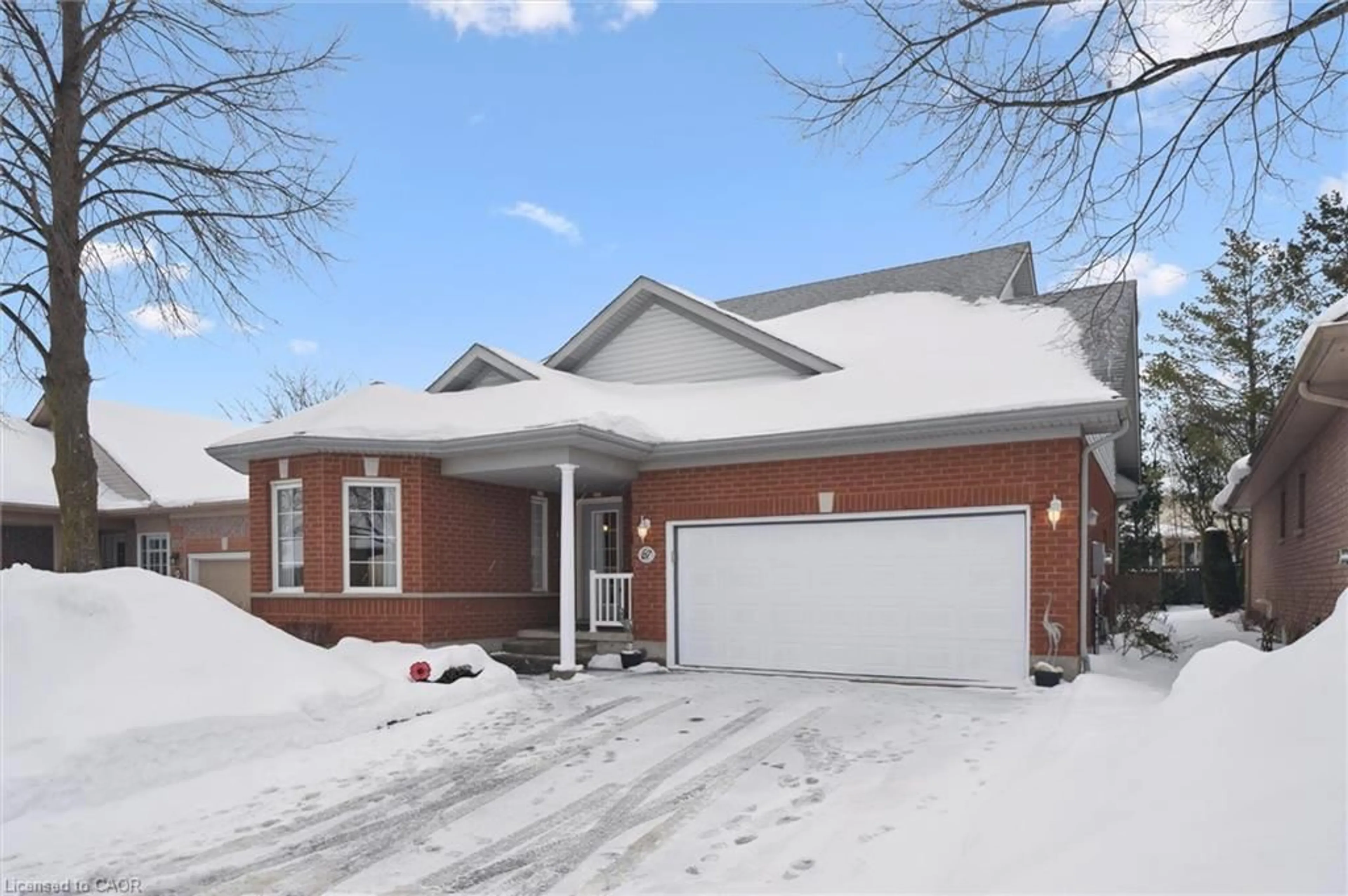 Home with brick exterior material, street for 67 Whitepine Way, Guelph Ontario N1G 4X7