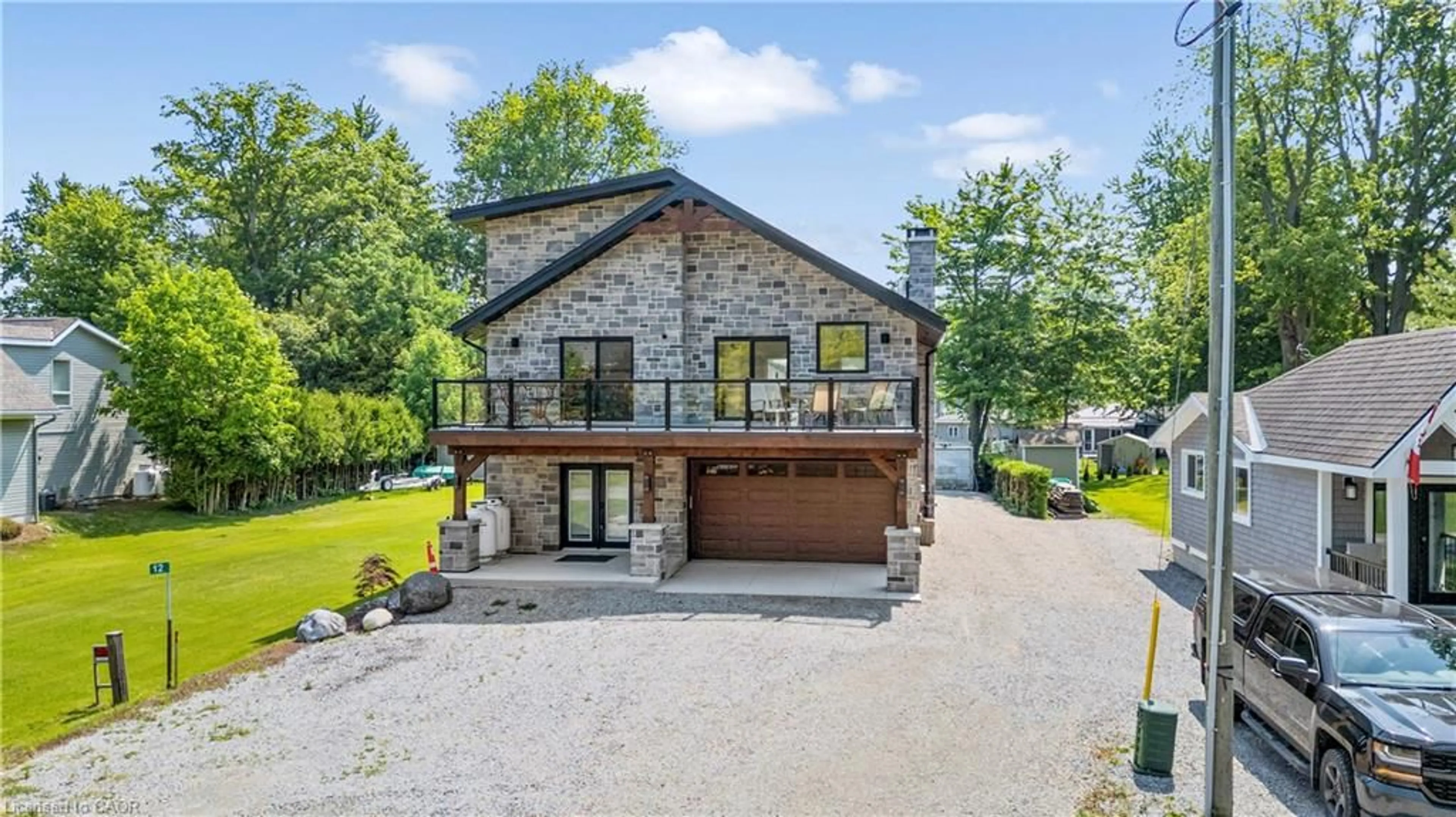 A pic from outside/outdoor area/front of a property/back of a property/a pic from drone, water/lake/river/ocean view for 12 Park Lane Cres, Turkey Point Ontario N0E 1T0