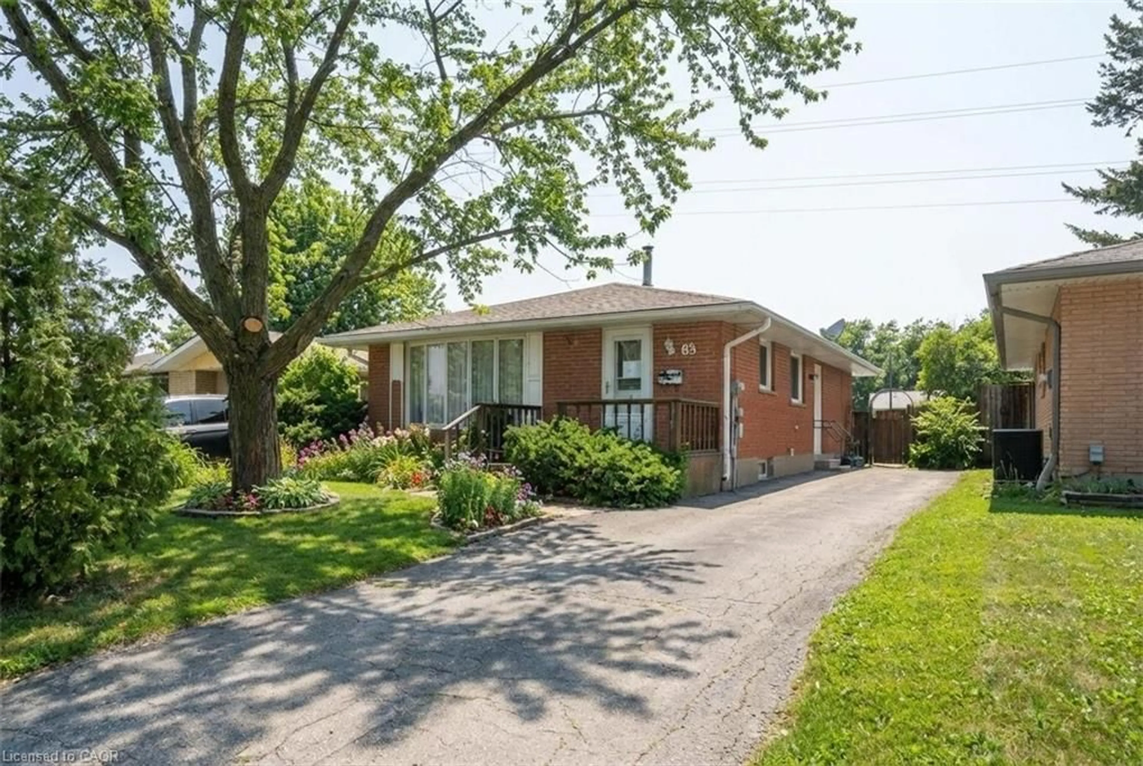 Home with brick exterior material, street for 66 Geneva Cres, Kitchener Ontario N2E 1M9