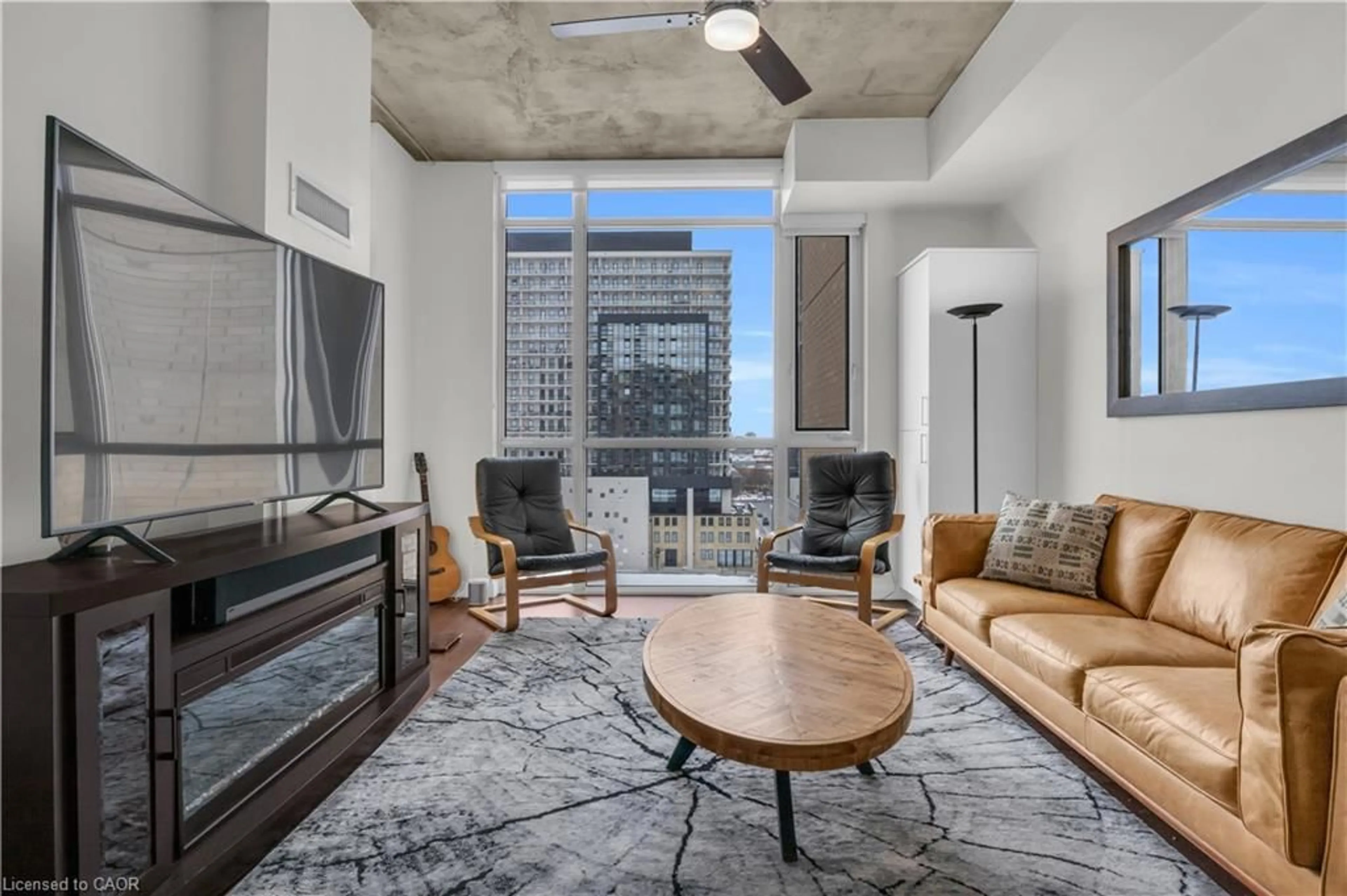 Living room with furniture, cement floor for 191 King St #803, Waterloo Ontario N2J 1R1