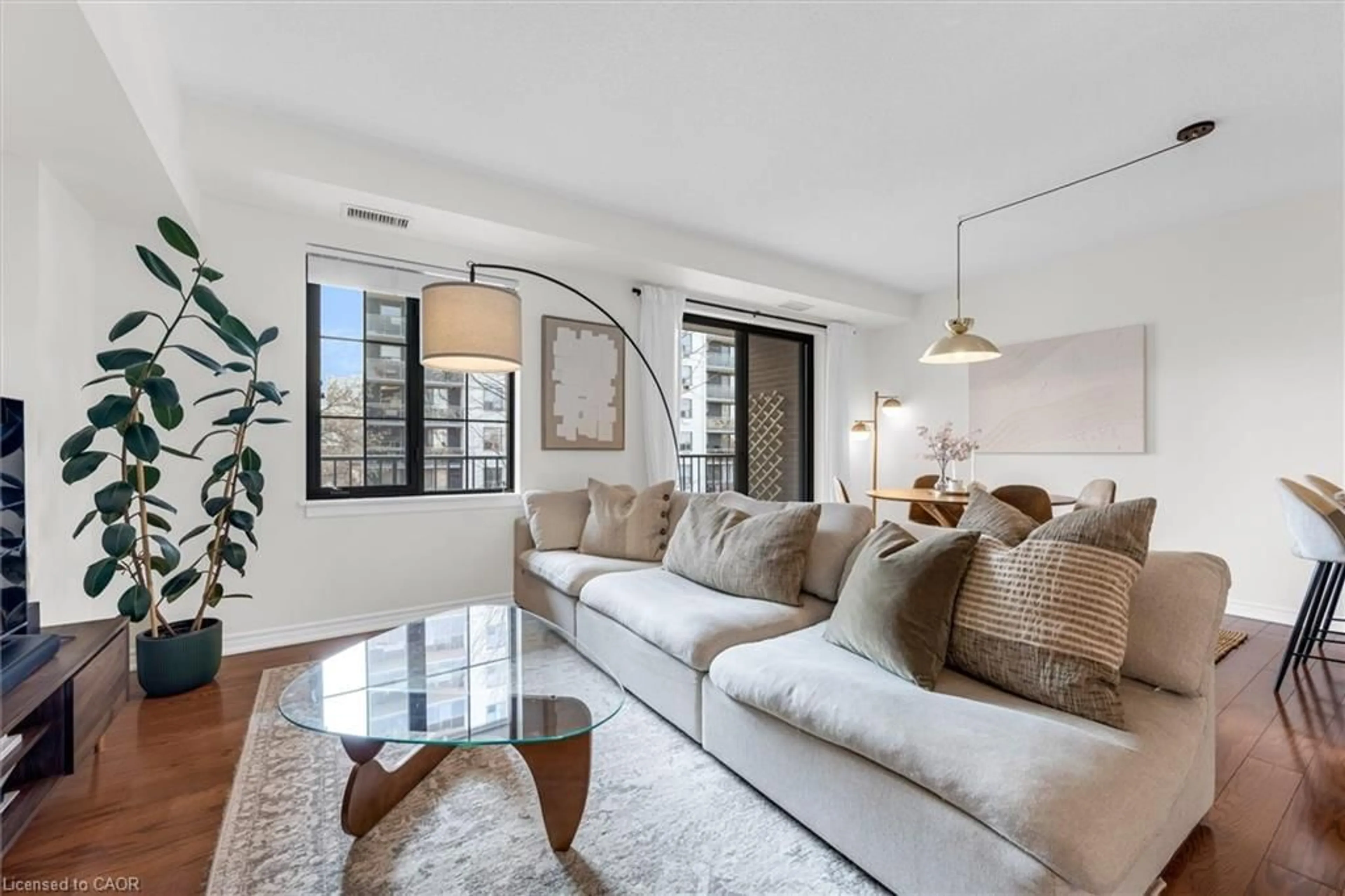 Living room with furniture, unknown for 47 Caroline St #409, Hamilton Ontario L8R 2R6