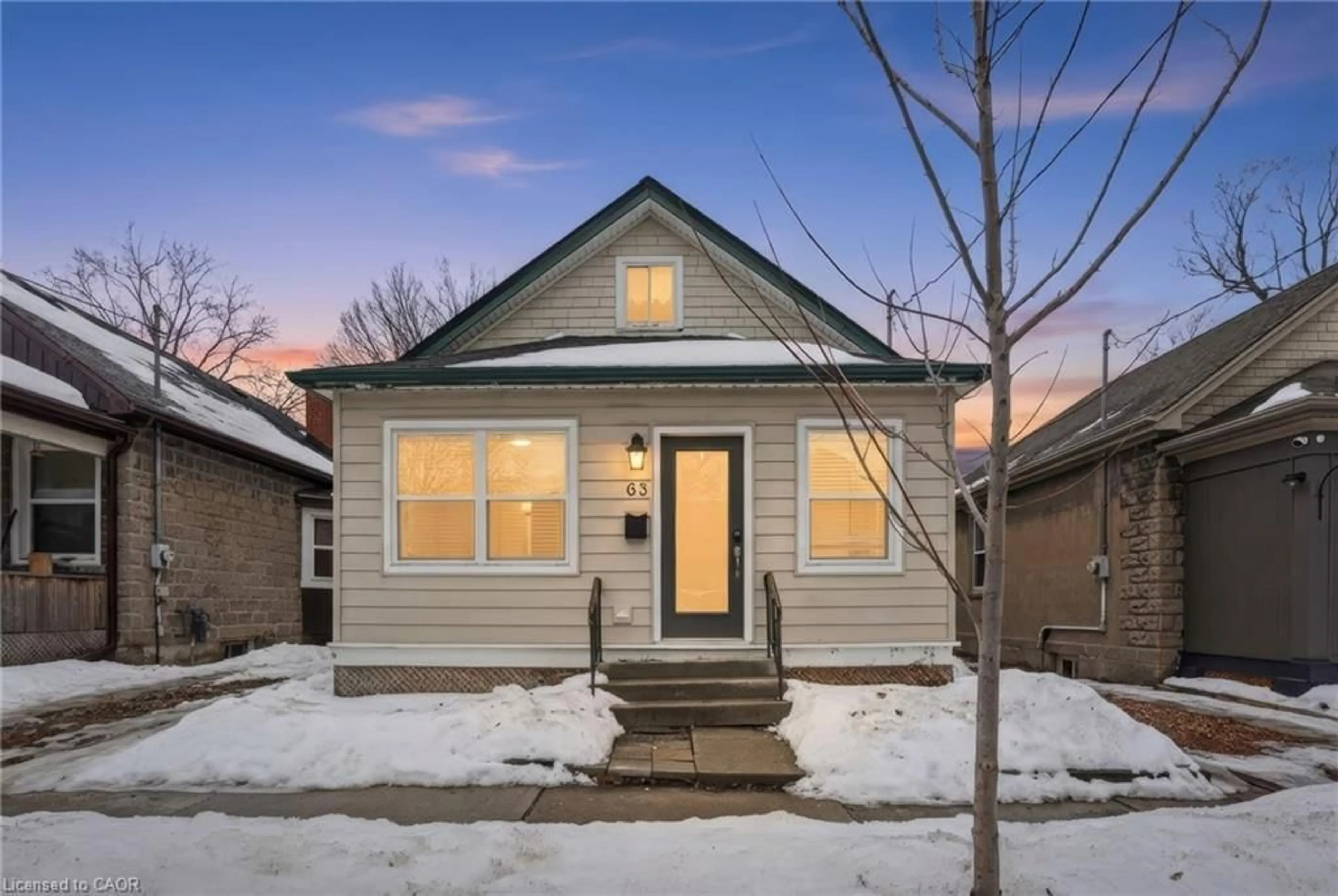 Home with vinyl exterior material, street for 63 Woodland Ave, St. Catharines Ontario L2R 5A4