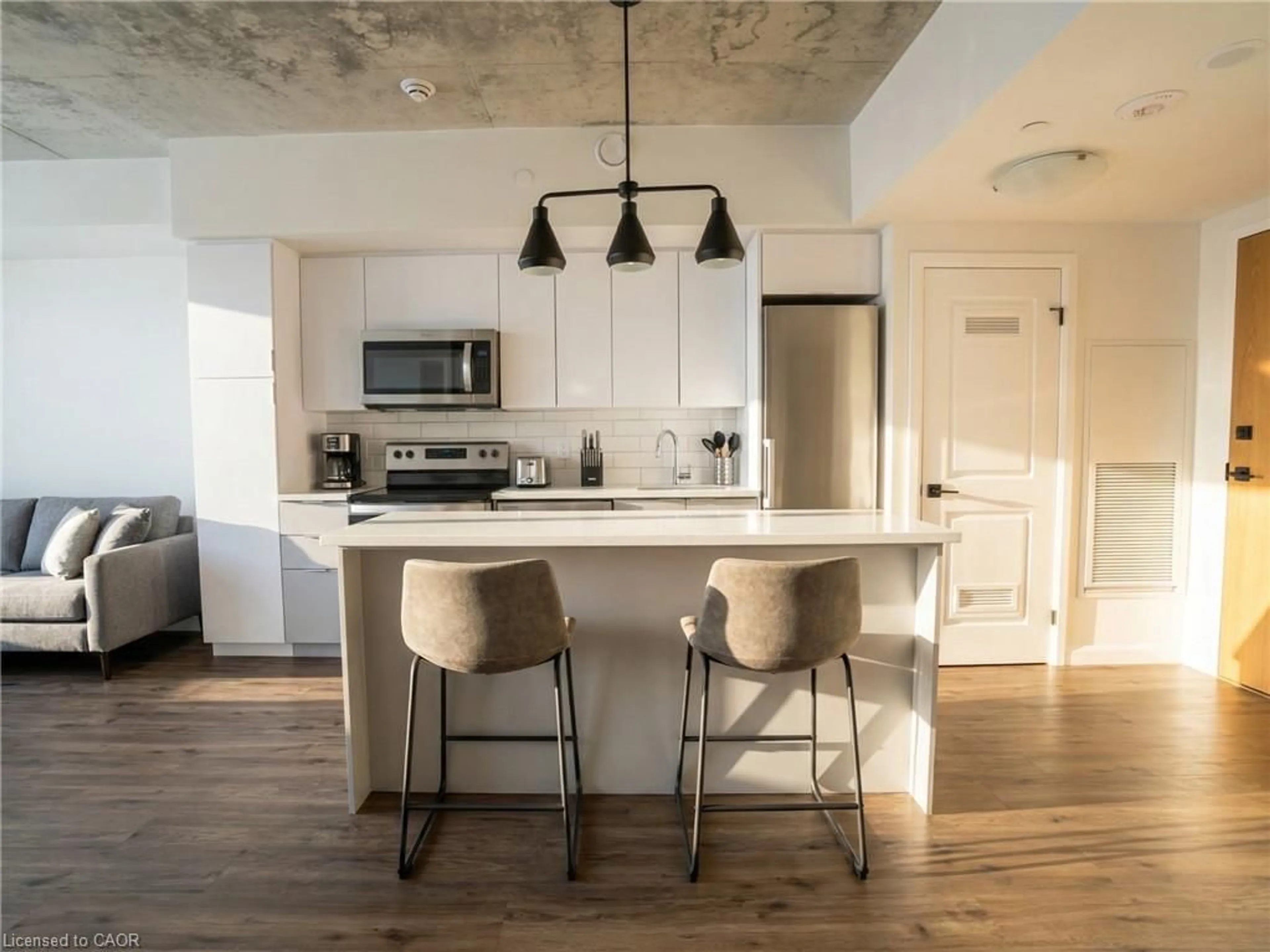 Open concept kitchen, cement floor for 7 Erie Ave, Brantford Ontario N3S 0K5