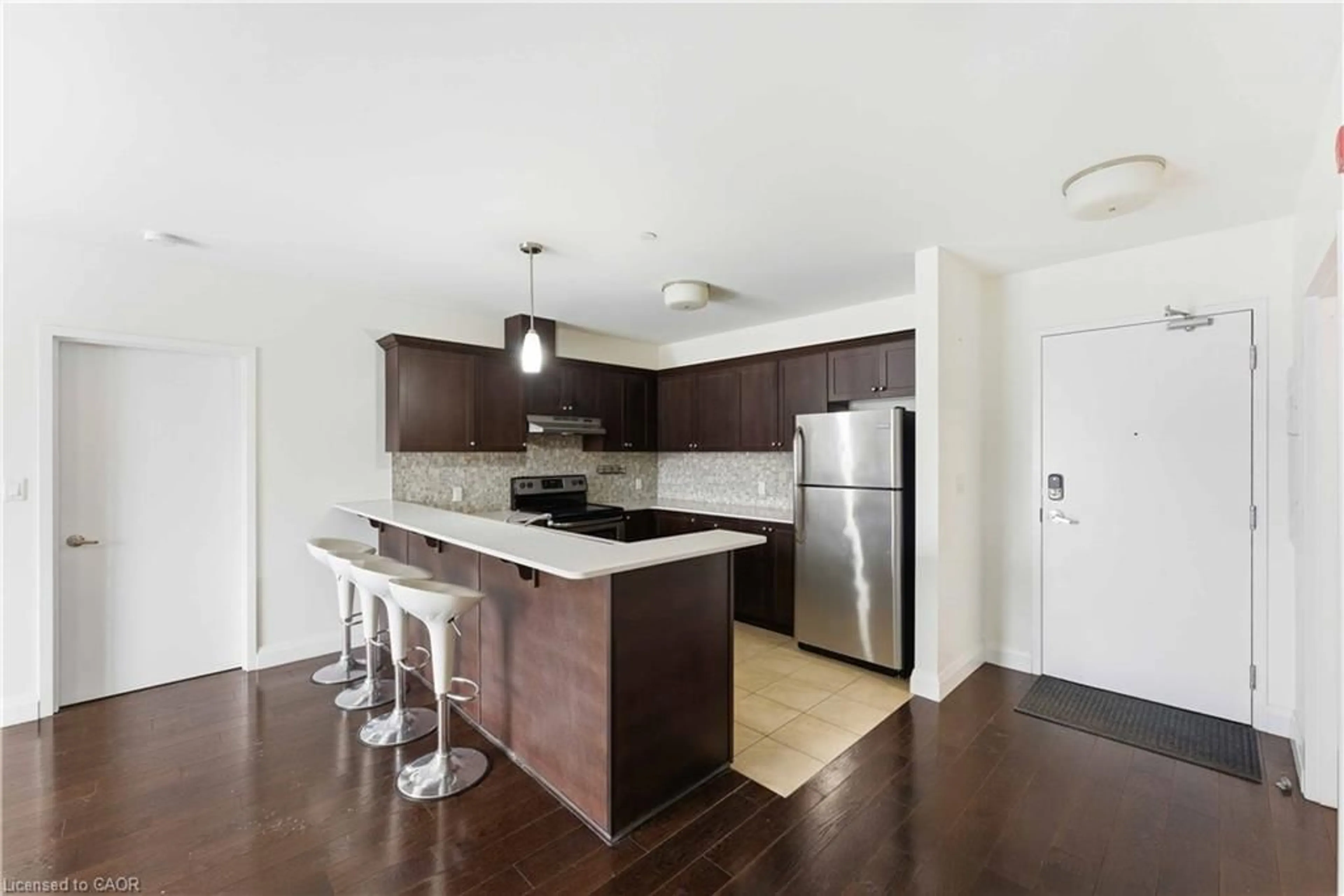 Open concept kitchen, wood/laminate floor for 26 Wellington St #404, St. Catharines Ontario L2R 6Y8