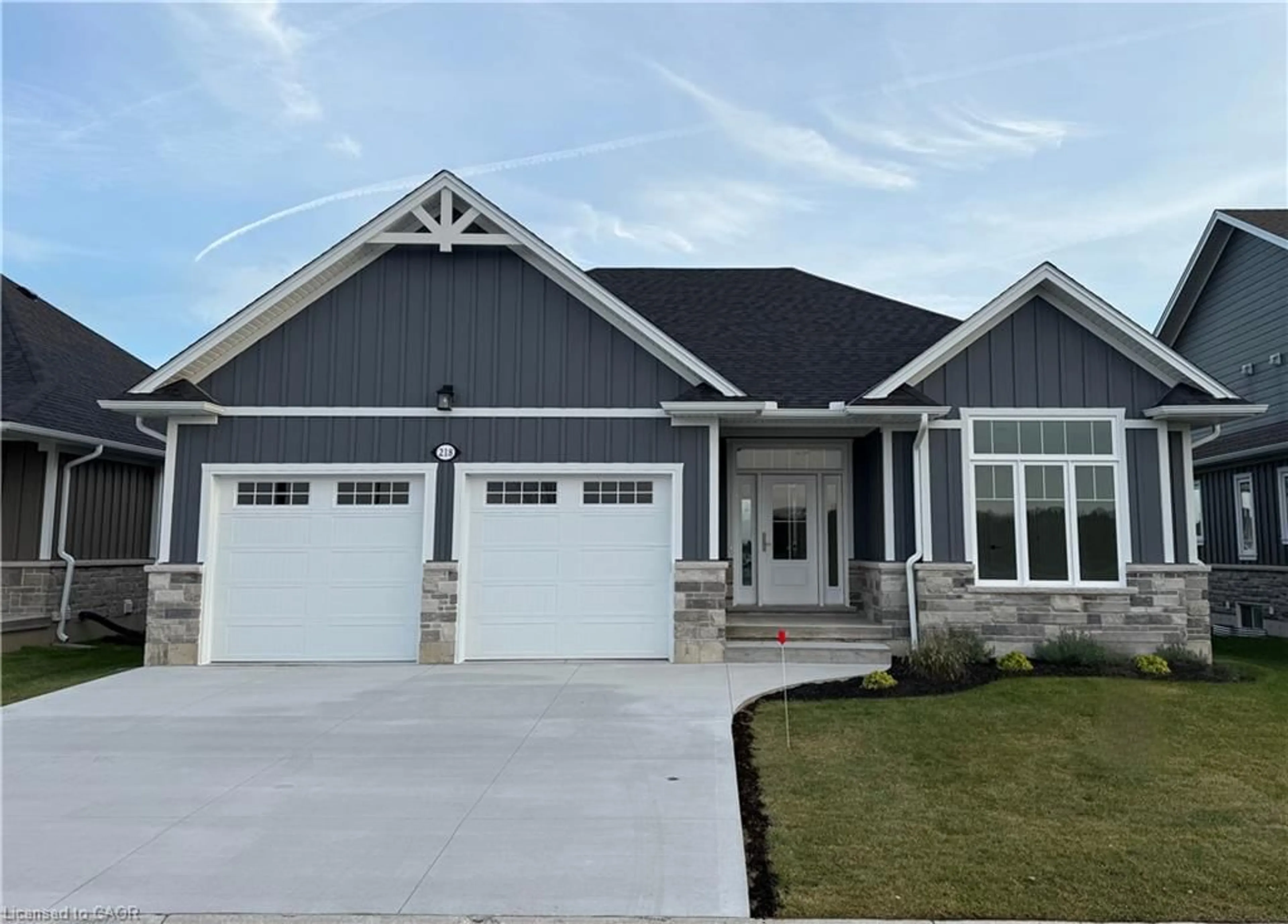Home with vinyl exterior material, street for 218 Schooner Dr, Port Dover Ontario N0A 1N3