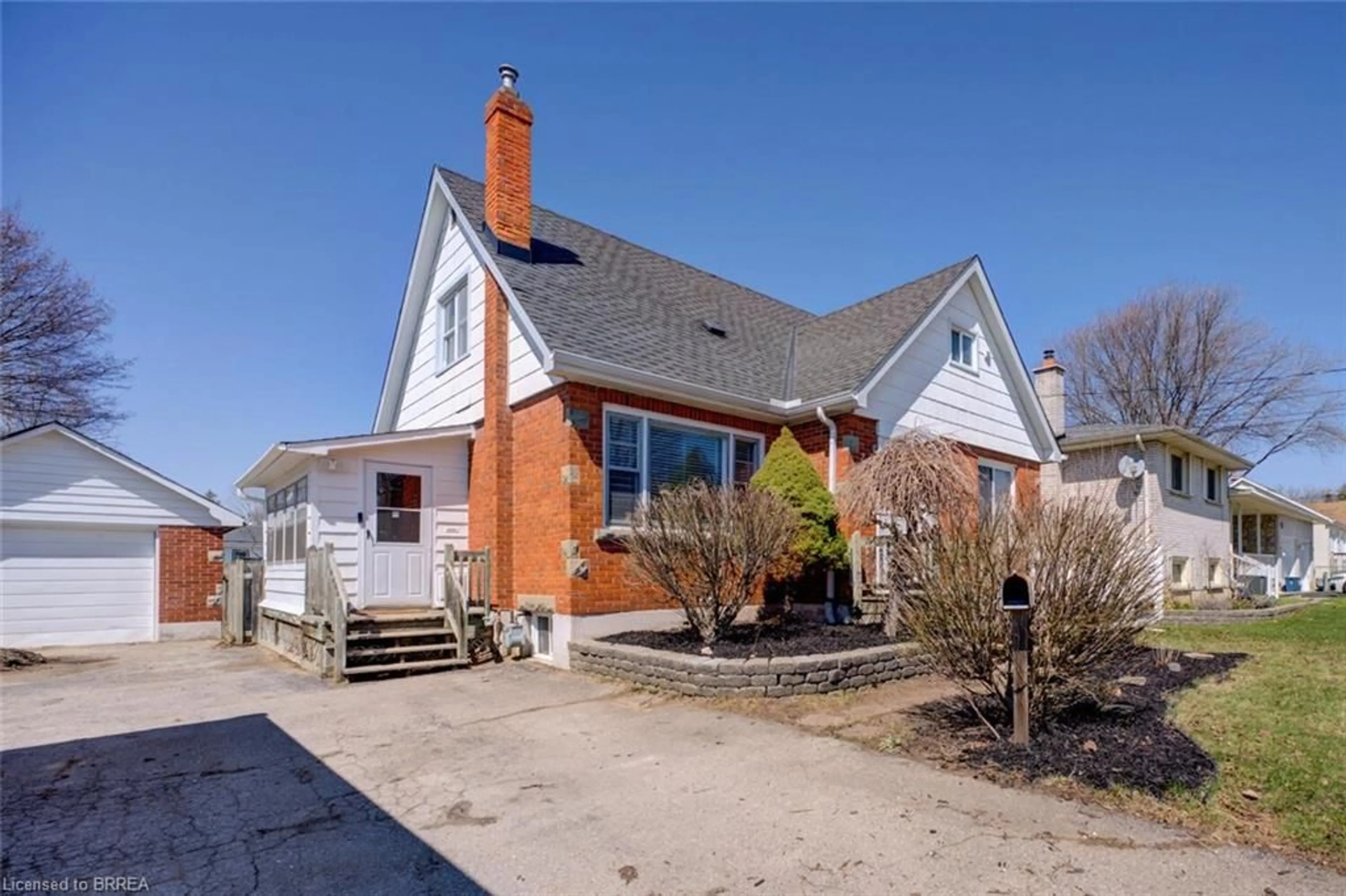 Home with brick exterior material, street for 214 Grand St, Brantford Ontario N3R 4C3