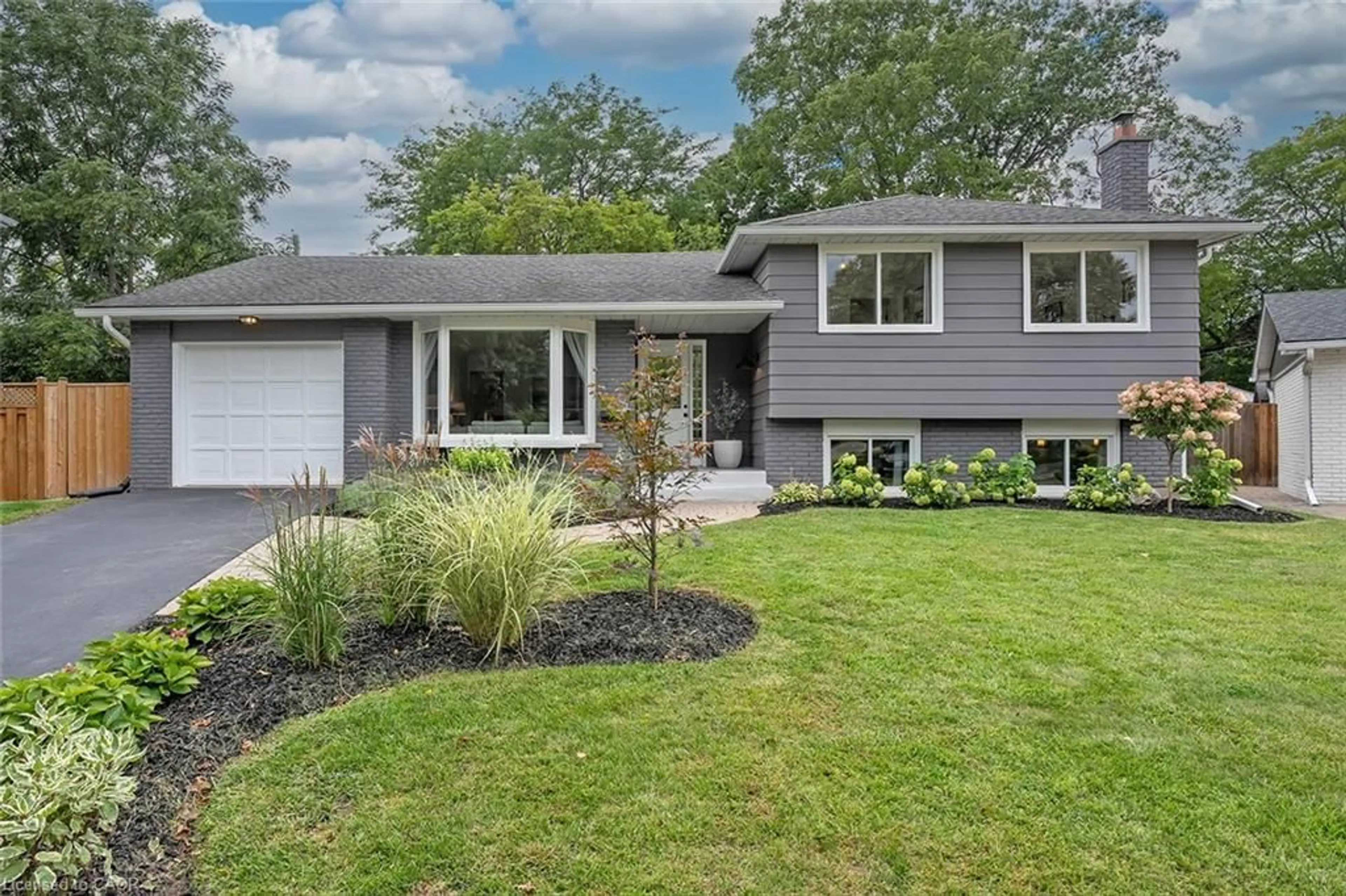 Home with vinyl exterior material, street for 406 Oakwood Dr, Burlington Ontario L7N 1X2